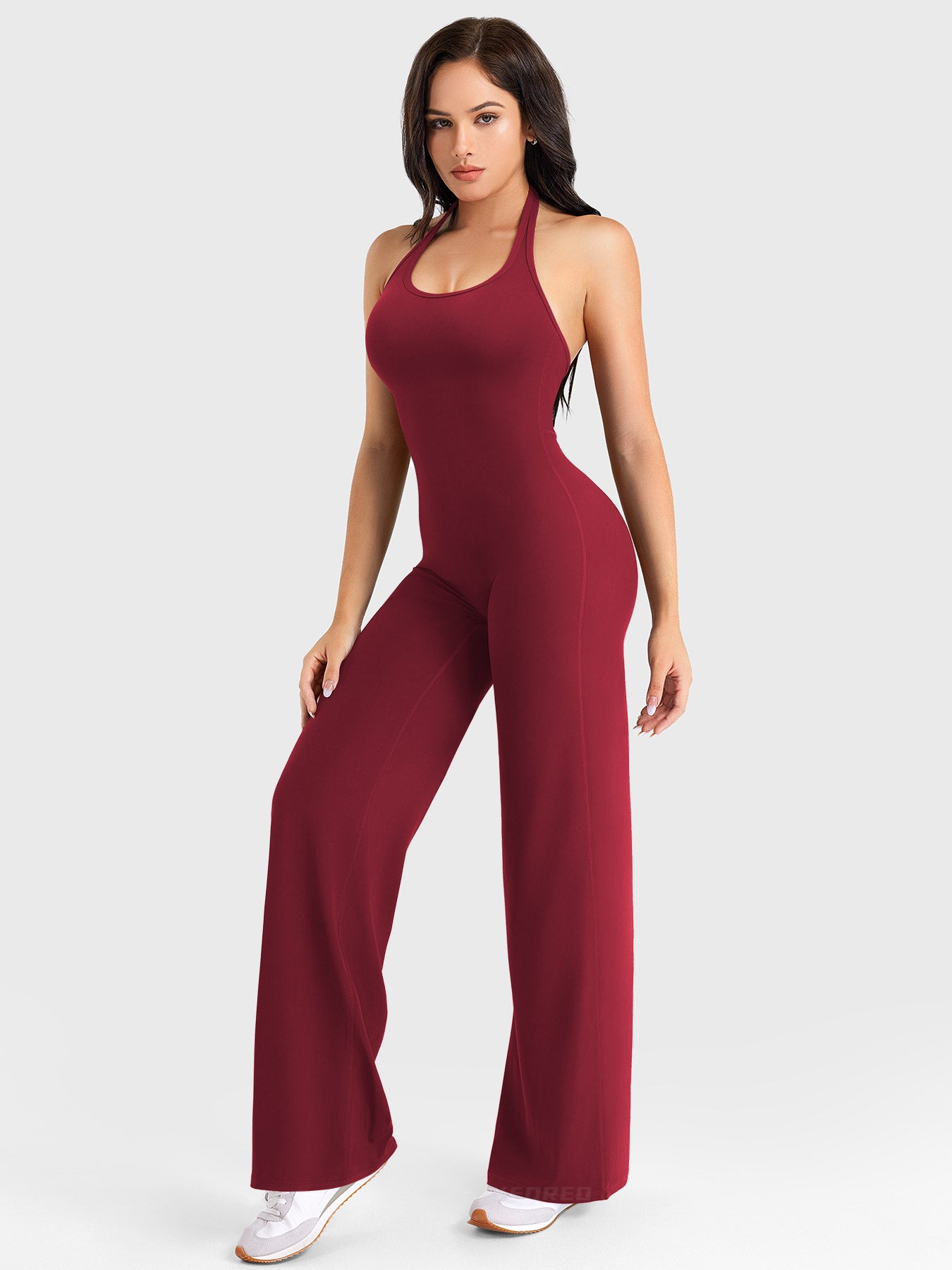 Side-front stretch pose wearing anchor red halter straight-leg jumpsuit