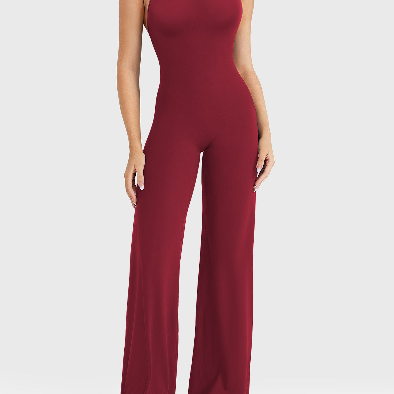 Front view—model wearing anchor red halter open-back straight-leg jumpsuit