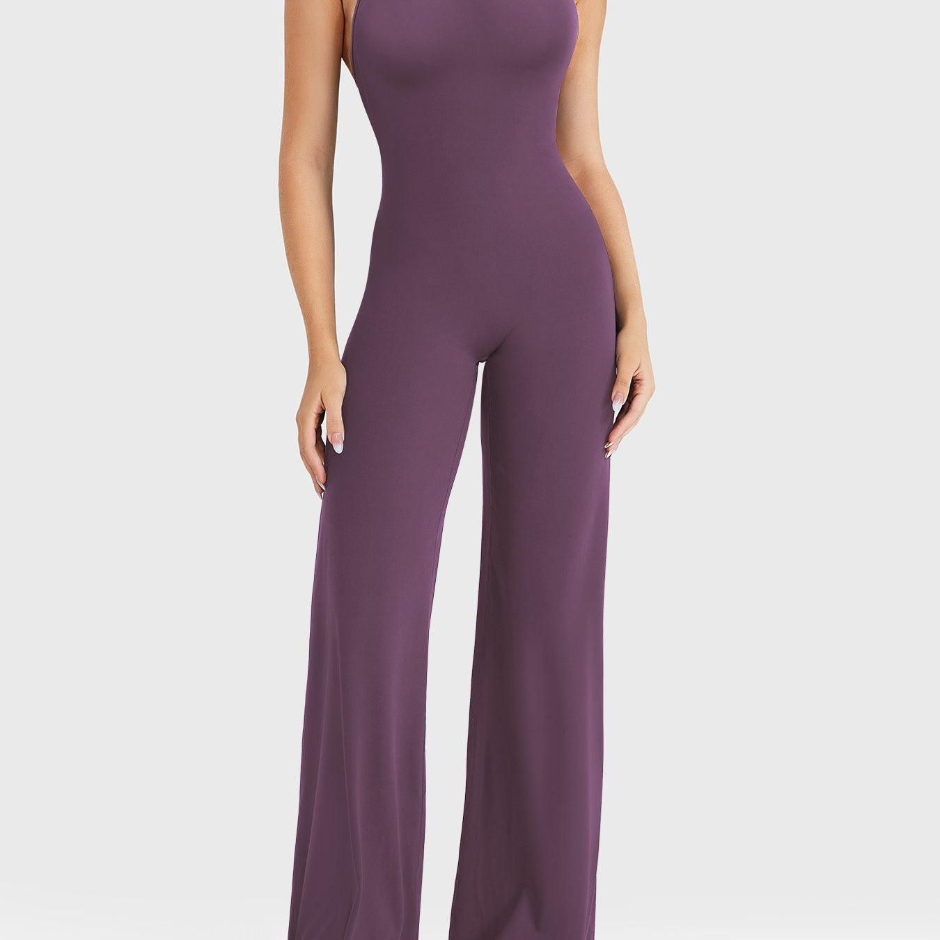 Front view—model wearing black berry halter open-back straight-leg jumpsuit