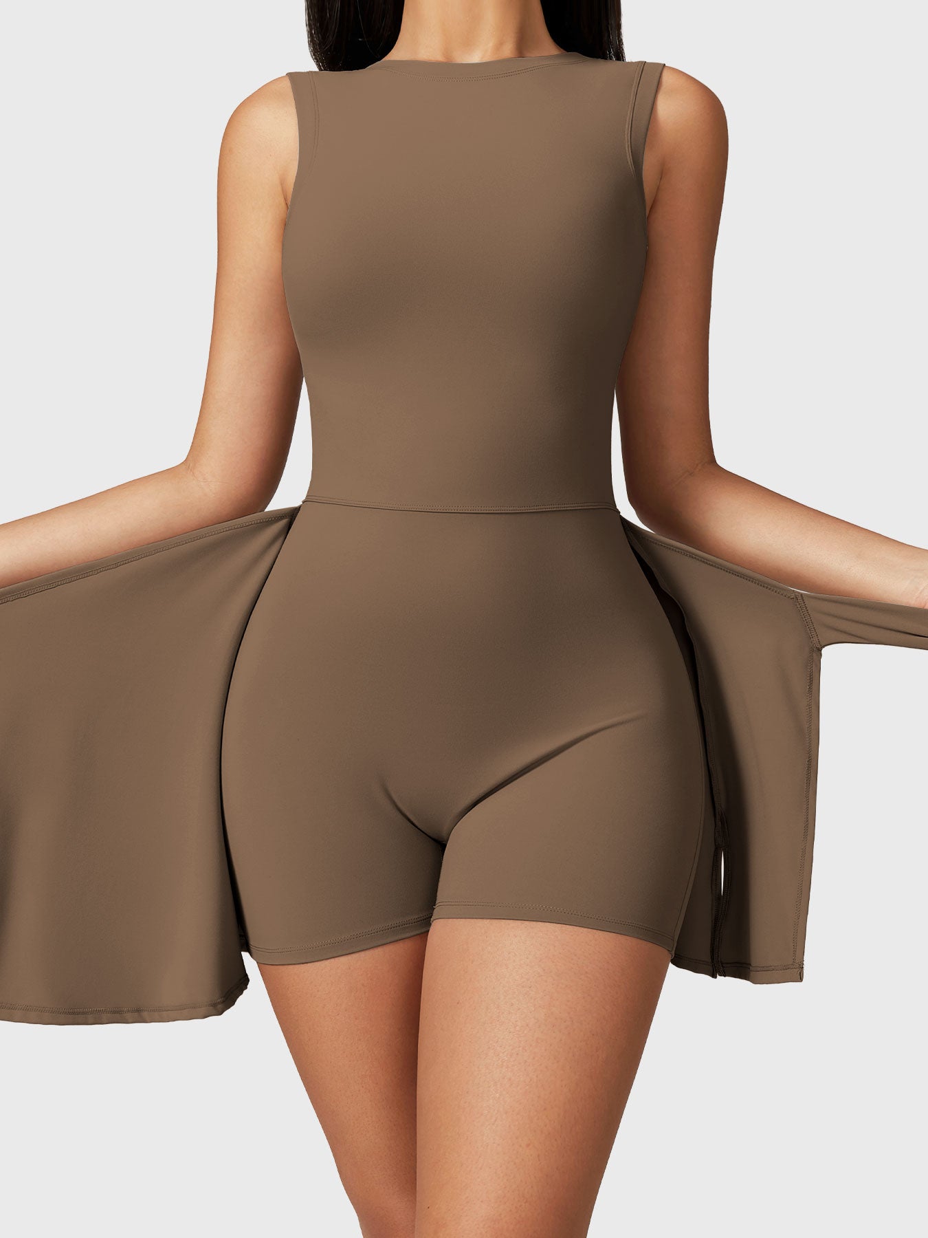 Front view of the Yeoreo Renee Sleeveless Tennis Dress in brown, showcasing customizable tie design