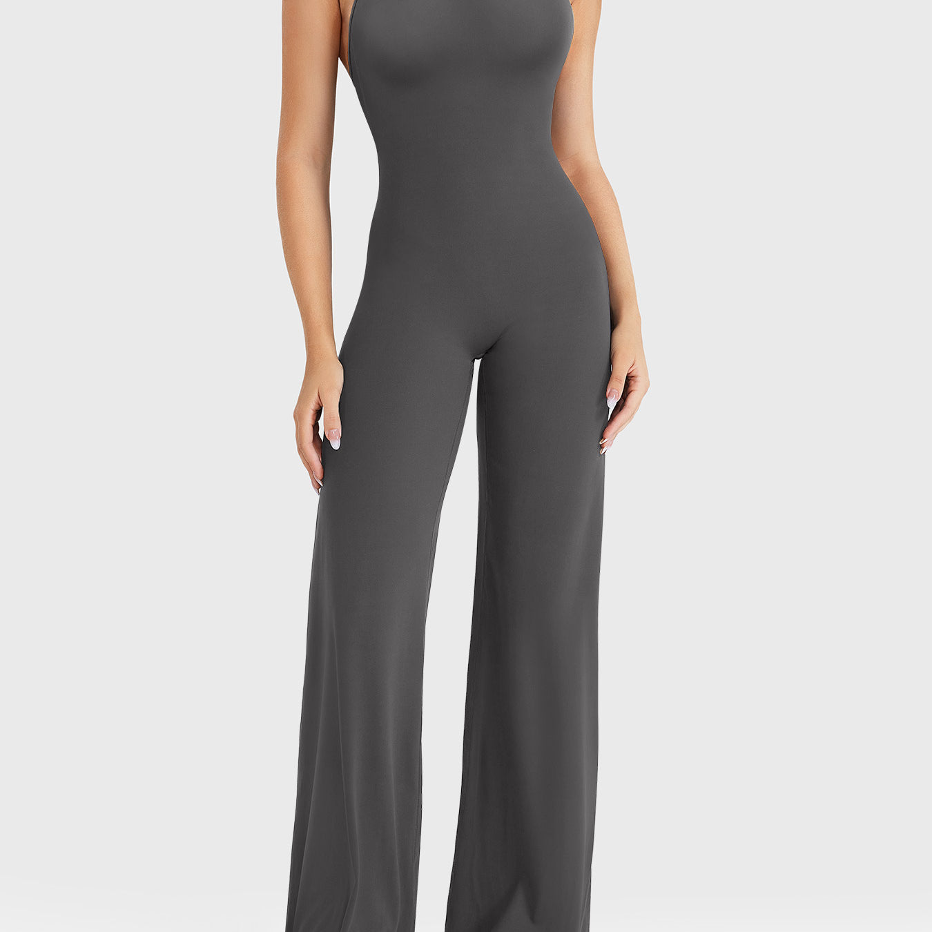 Front view—model wearing dark grey halter open-back straight-leg jumpsuit