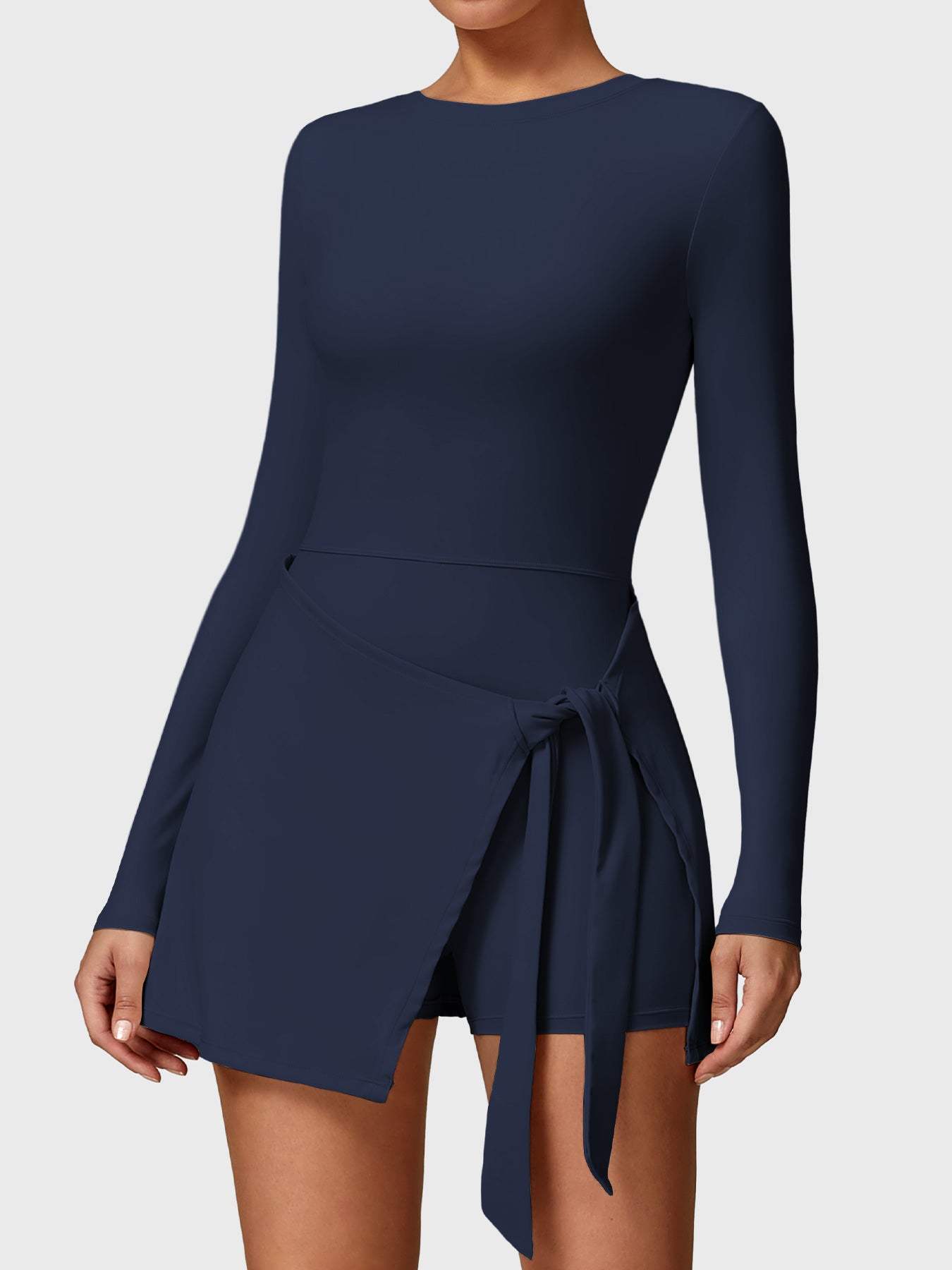 Front view of Yeoreo Renee Long Sleeve Tennis Dress in deep blue, showcasing round neckline and A-line skirt