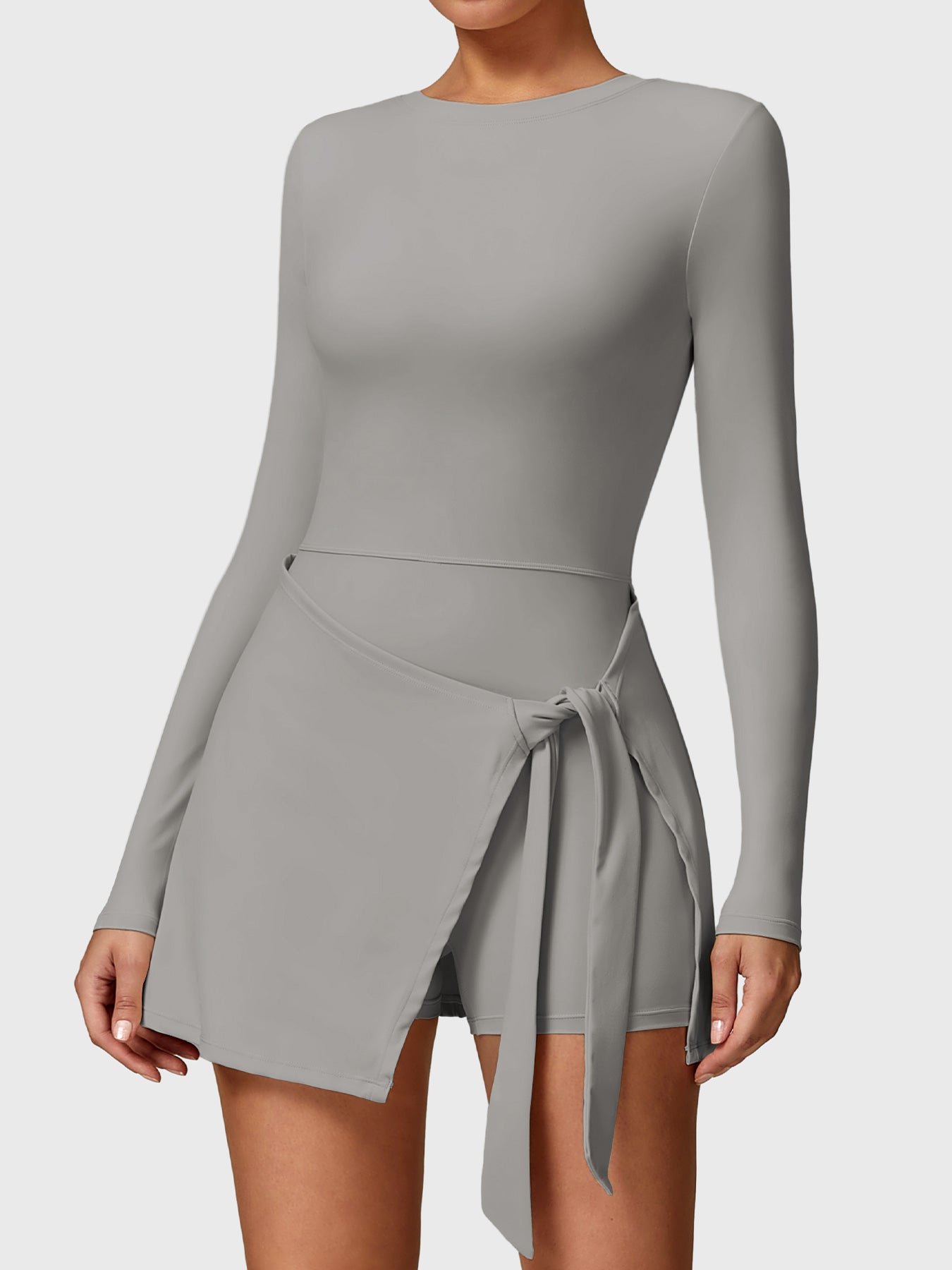 Front view of Yeoreo Renee Long Sleeve Tennis Dress in grey, showcasing round neckline and A-line skirt