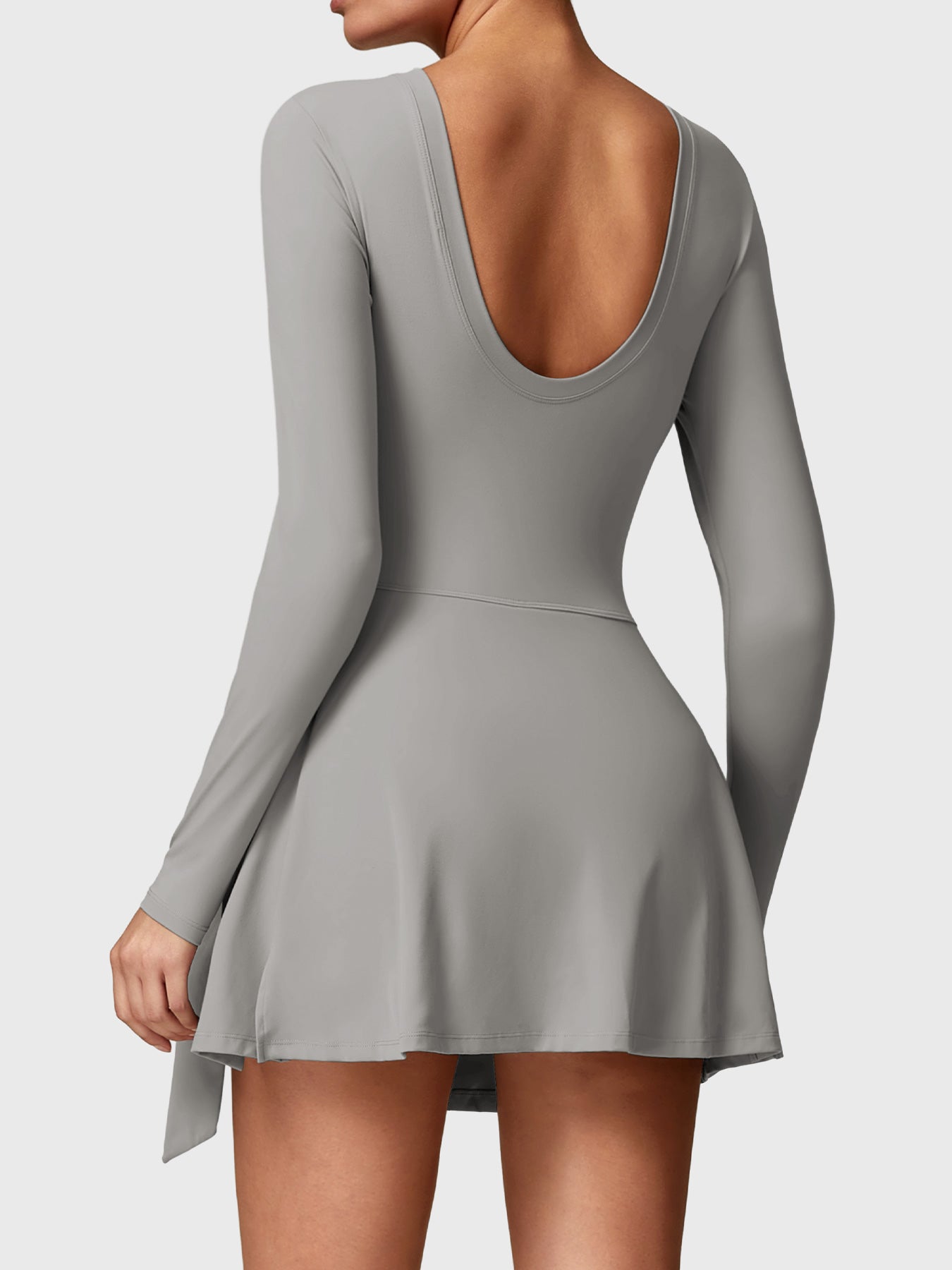 Back view of Yeoreo Renee Long Sleeve Tennis Dress in grey, highlighting U-back design