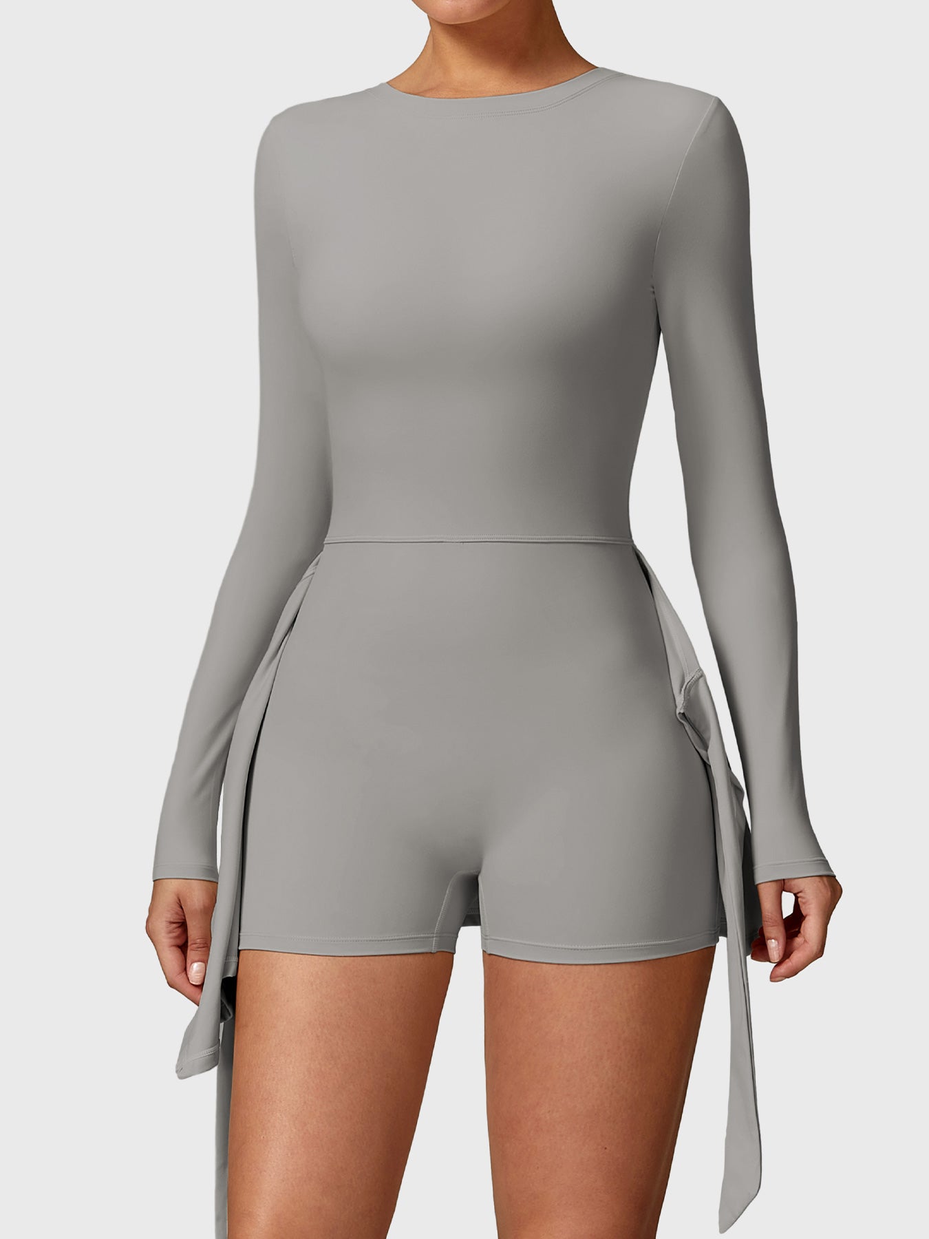 Front view of Yeoreo Renee Long Sleeve Tennis Dress in grey, showcasing built-in shorts