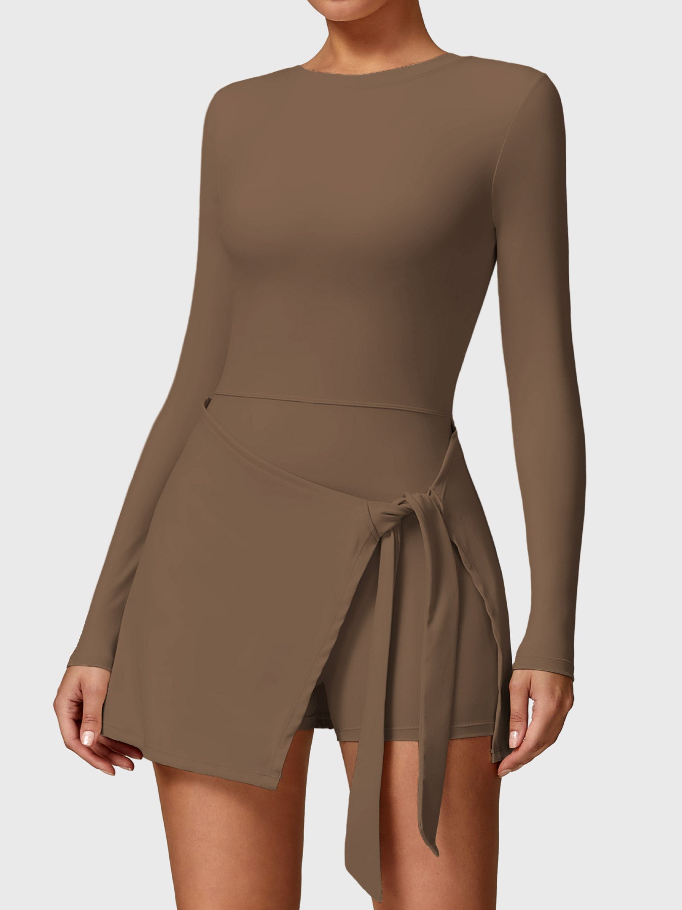 Front view of Yeoreo Renee Long Sleeve Tennis Dress in brown, showcasing round neckline and A-line skirt