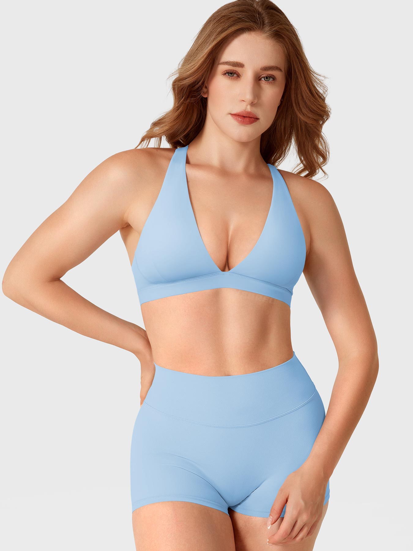 Airy Blue Yeoreo Wafiya V-neck sports bra front angle styled with matching shorts, supportive athletic fit