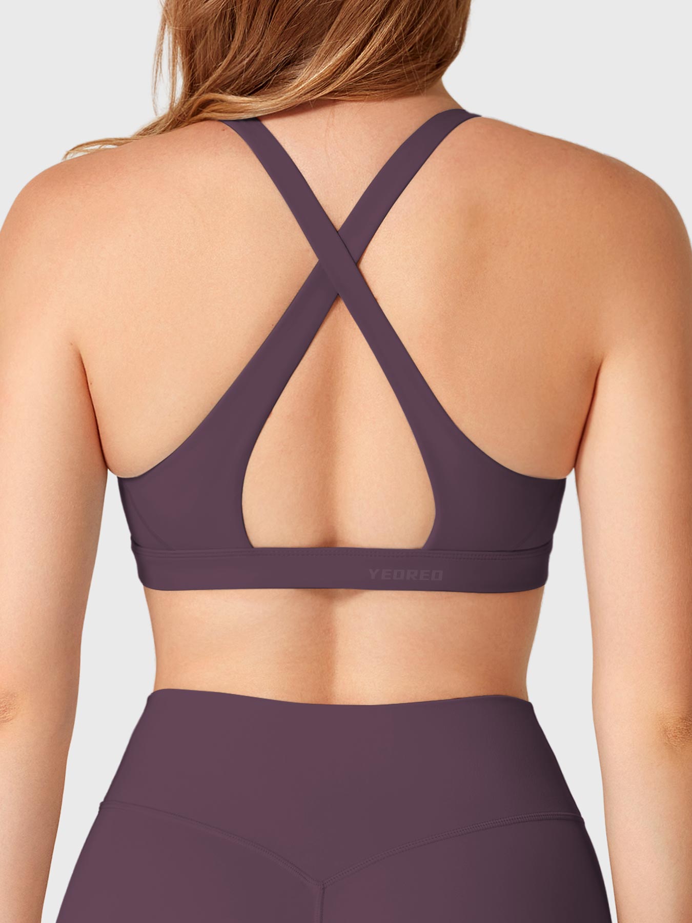 Black Berry Yeoreo Wafiya sports bra back view, elegant crisscross back straps with open center detail