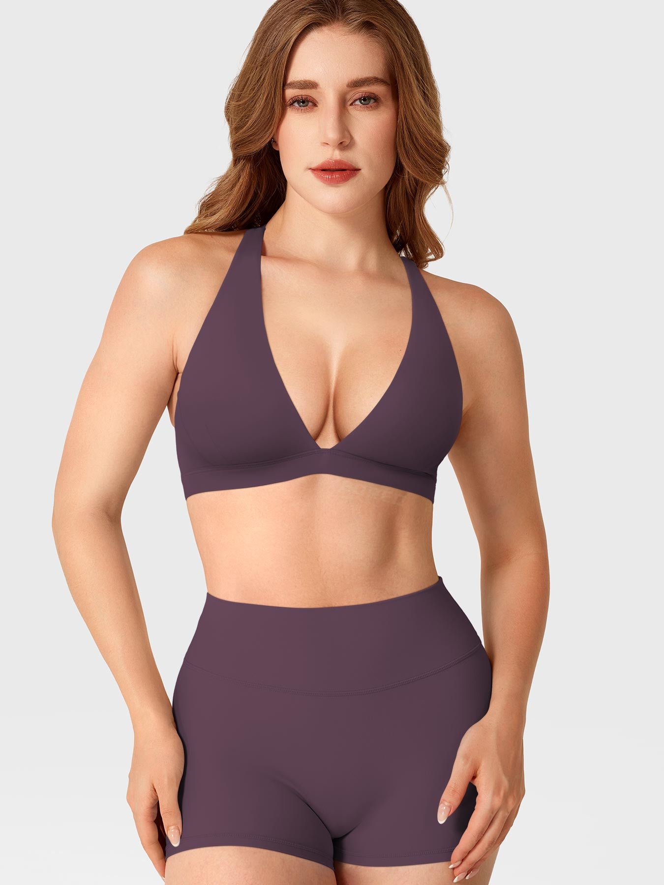 Black Berry Yeoreo Wafiya V-neck sports bra front angle styled with matching shorts, sculpting athletic silhouette