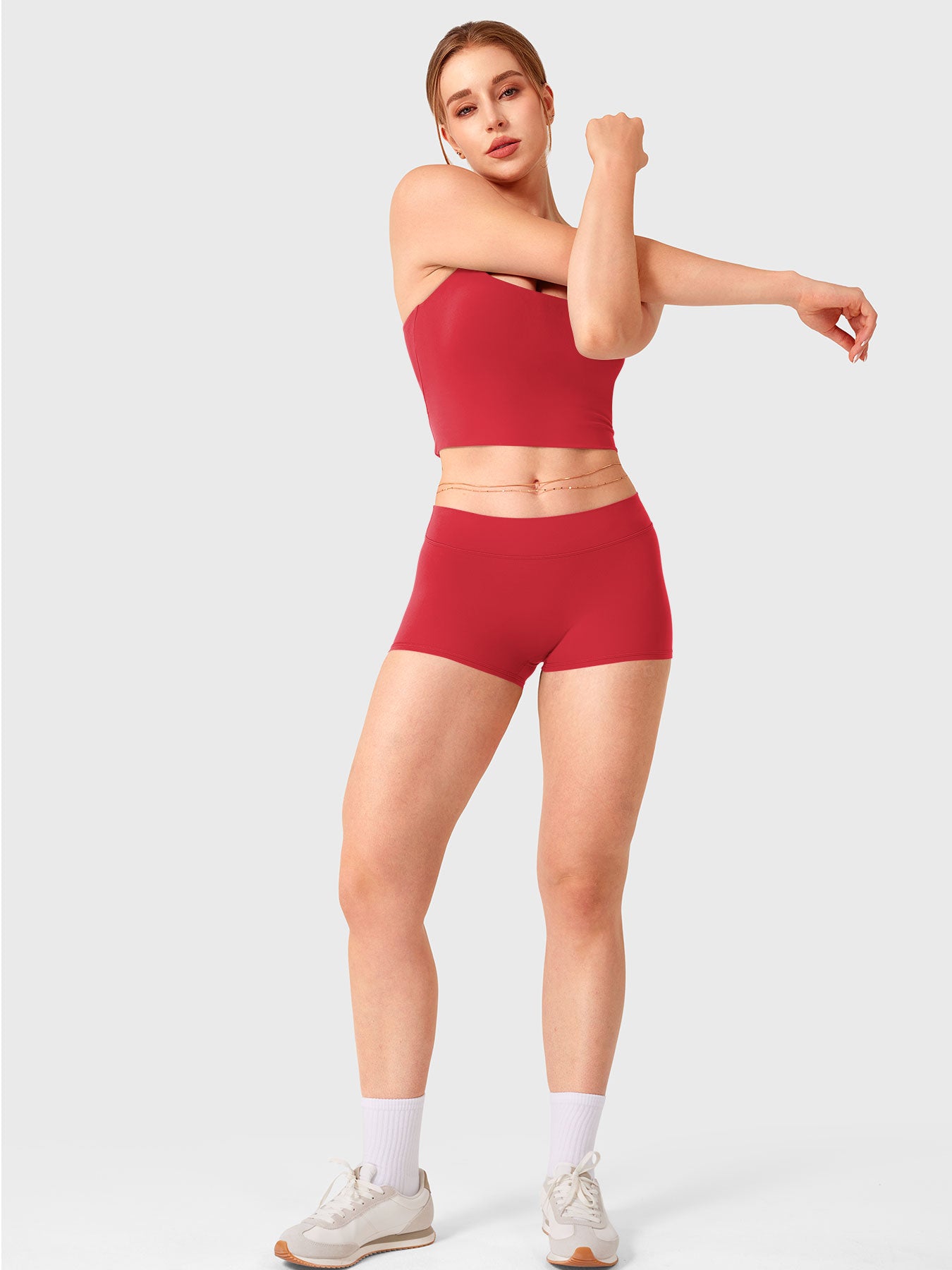 Red Yeoreo Zahida low rise shorts full body view styled with matching sports tank, athletic fitted silhouette