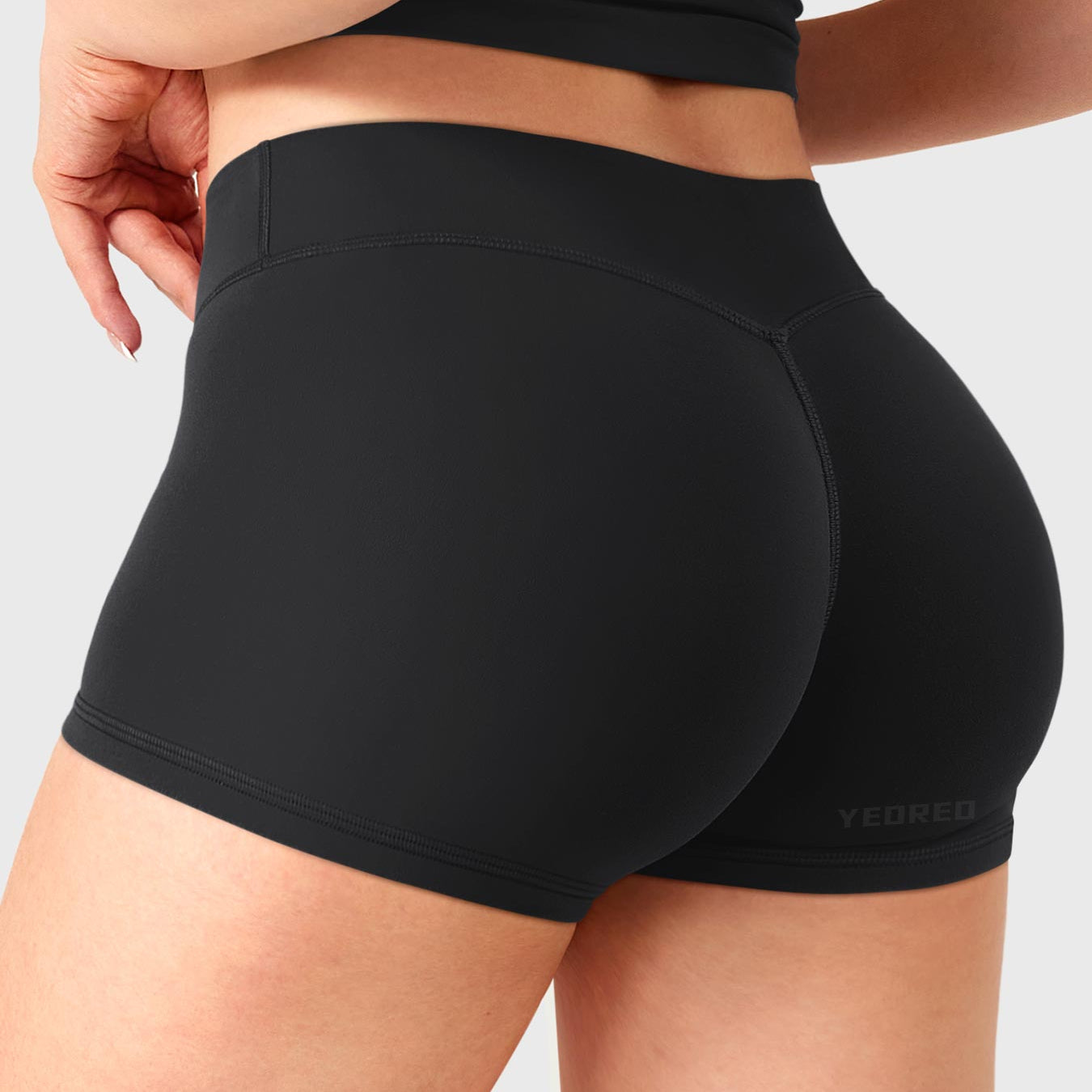 Black Yeoreo Zahida 2.5 inch low rise shorts angled back view, V-back shaping for natural lift