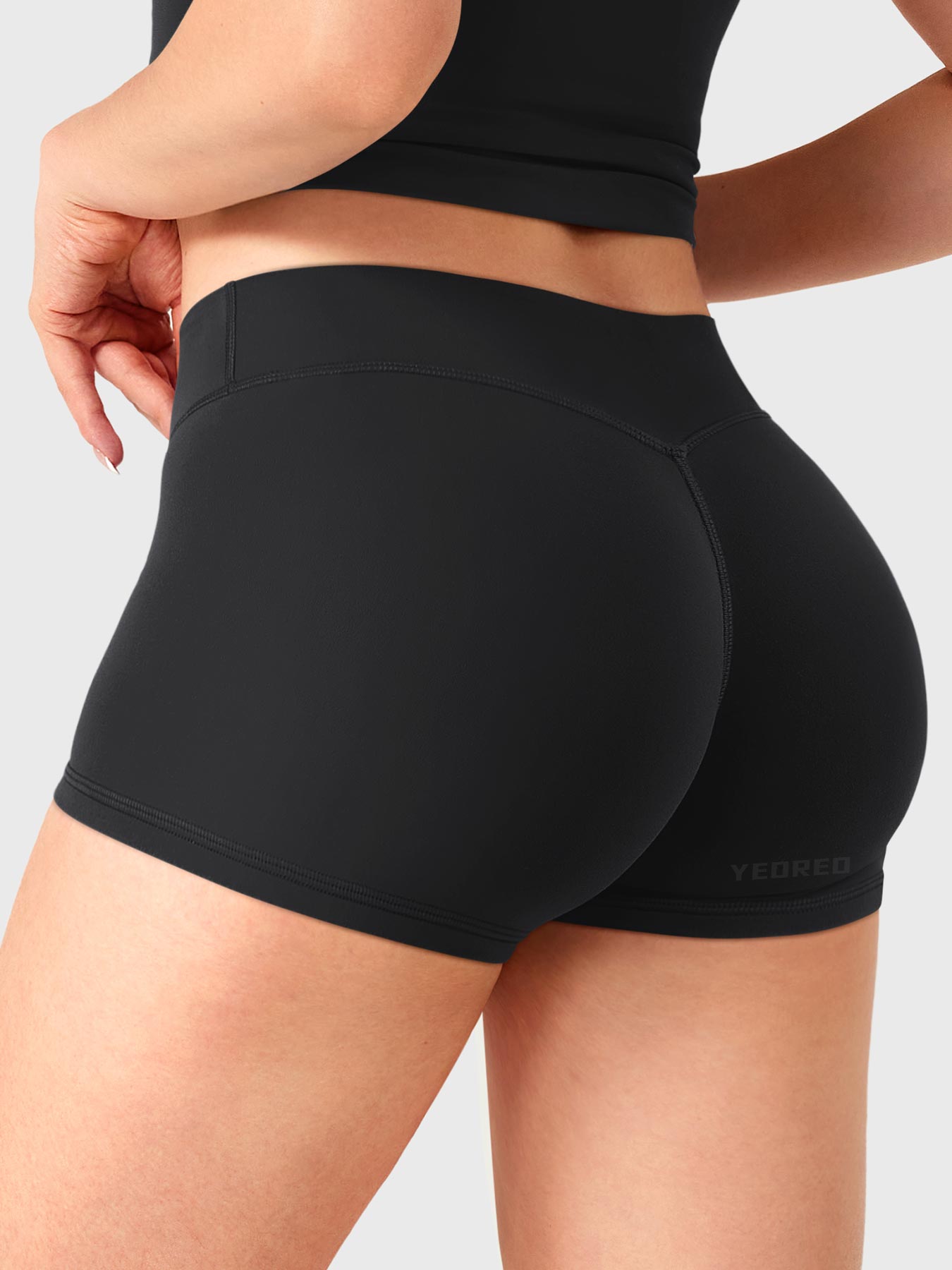 Black Yeoreo Zahida 2.5 inch low rise shorts angled back view, V-back shaping for natural lift