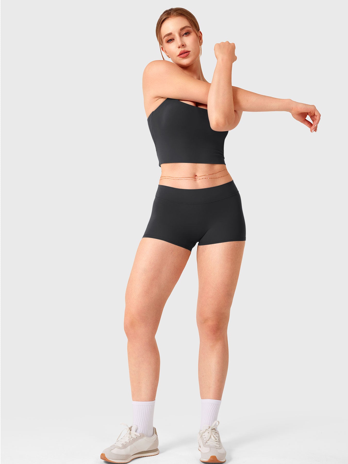 Black Yeoreo Zahida low rise shorts full body view paired with matching tank top, sporty coordinated look