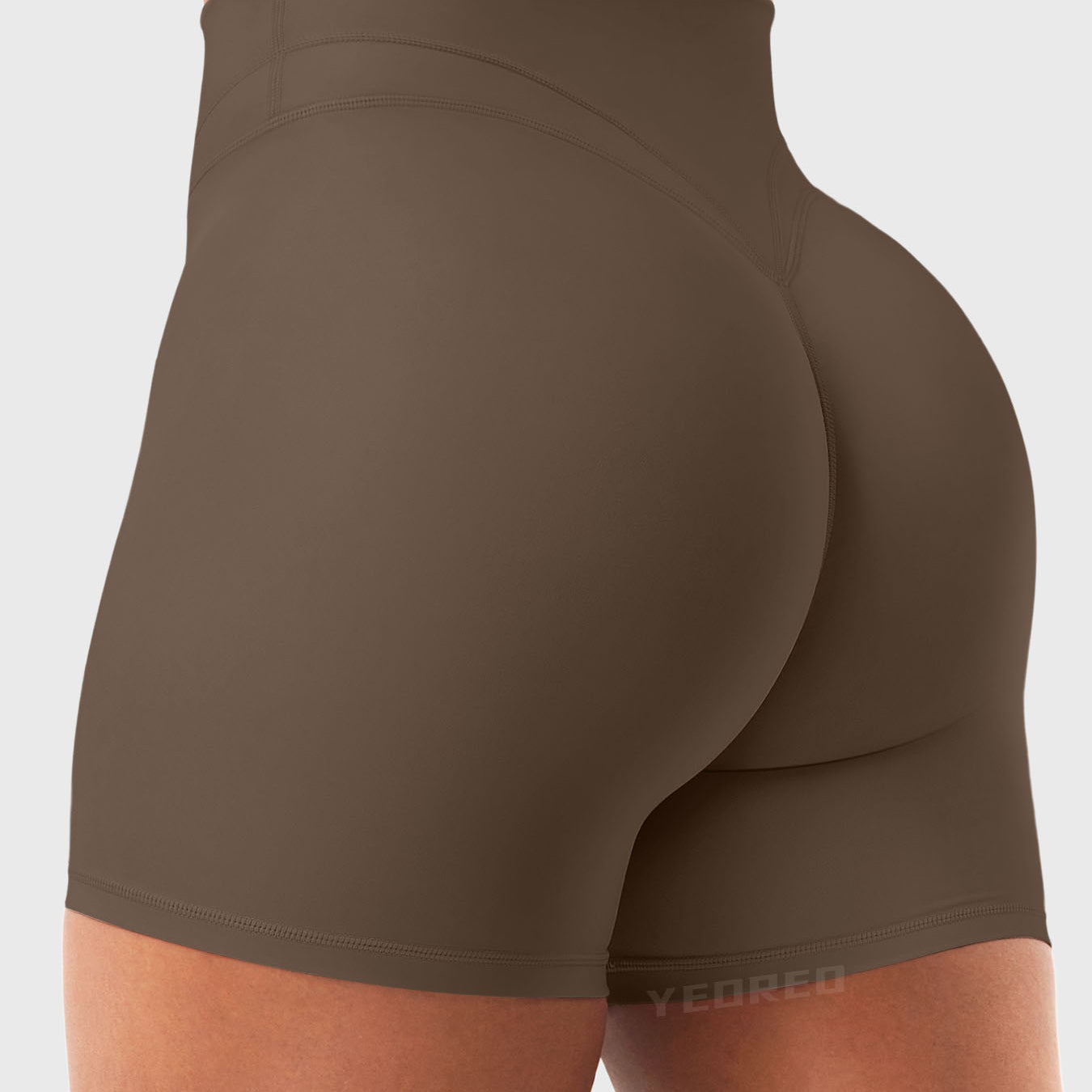 Side Back view of Yeoreo Almiy High Waisted Workout Shorts in Coffee – V-stitch waistband and glute-lifting contour