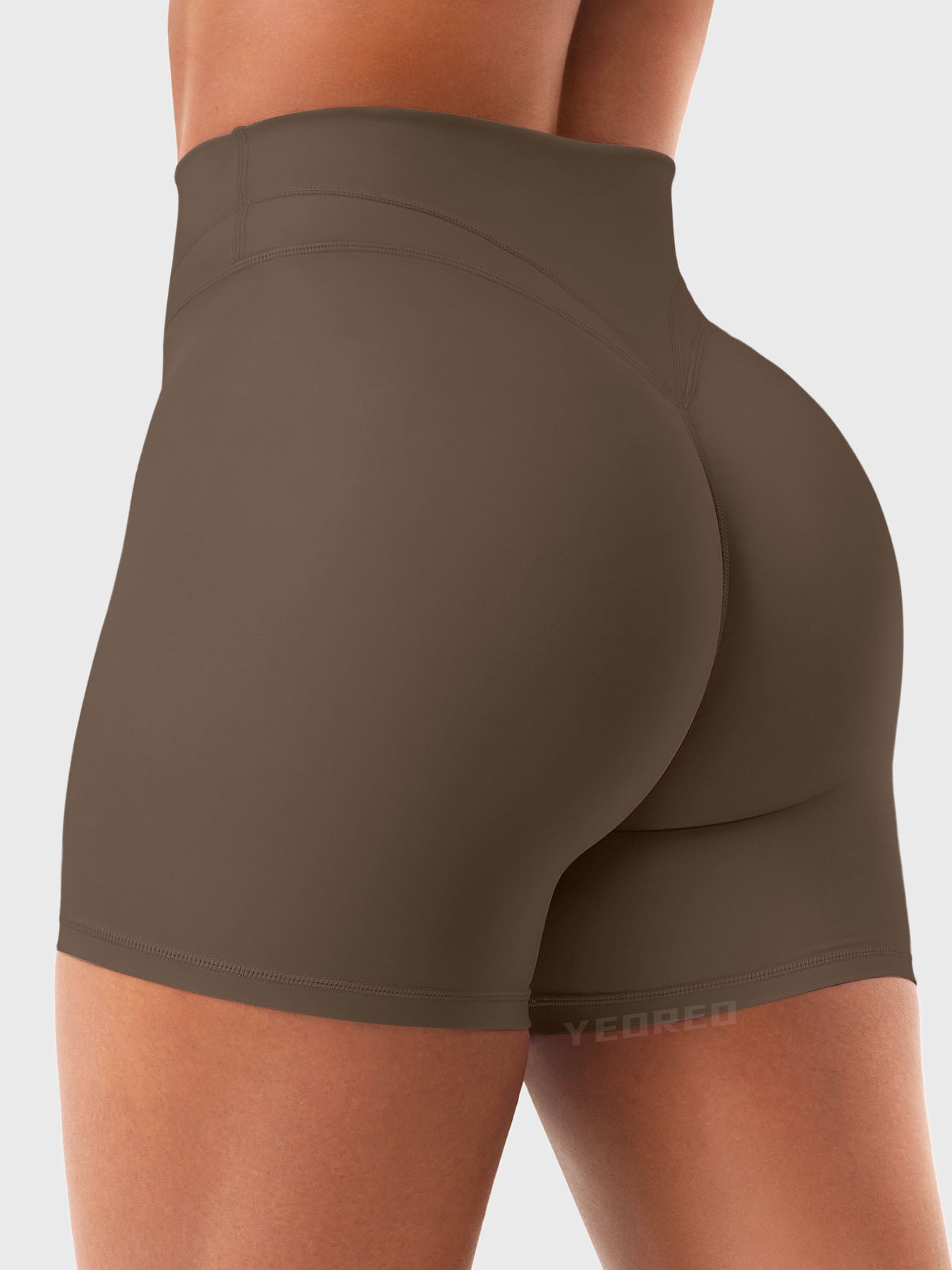 Side Back view of Yeoreo Almiy High Waisted Workout Shorts in Coffee – V-stitch waistband and glute-lifting contour