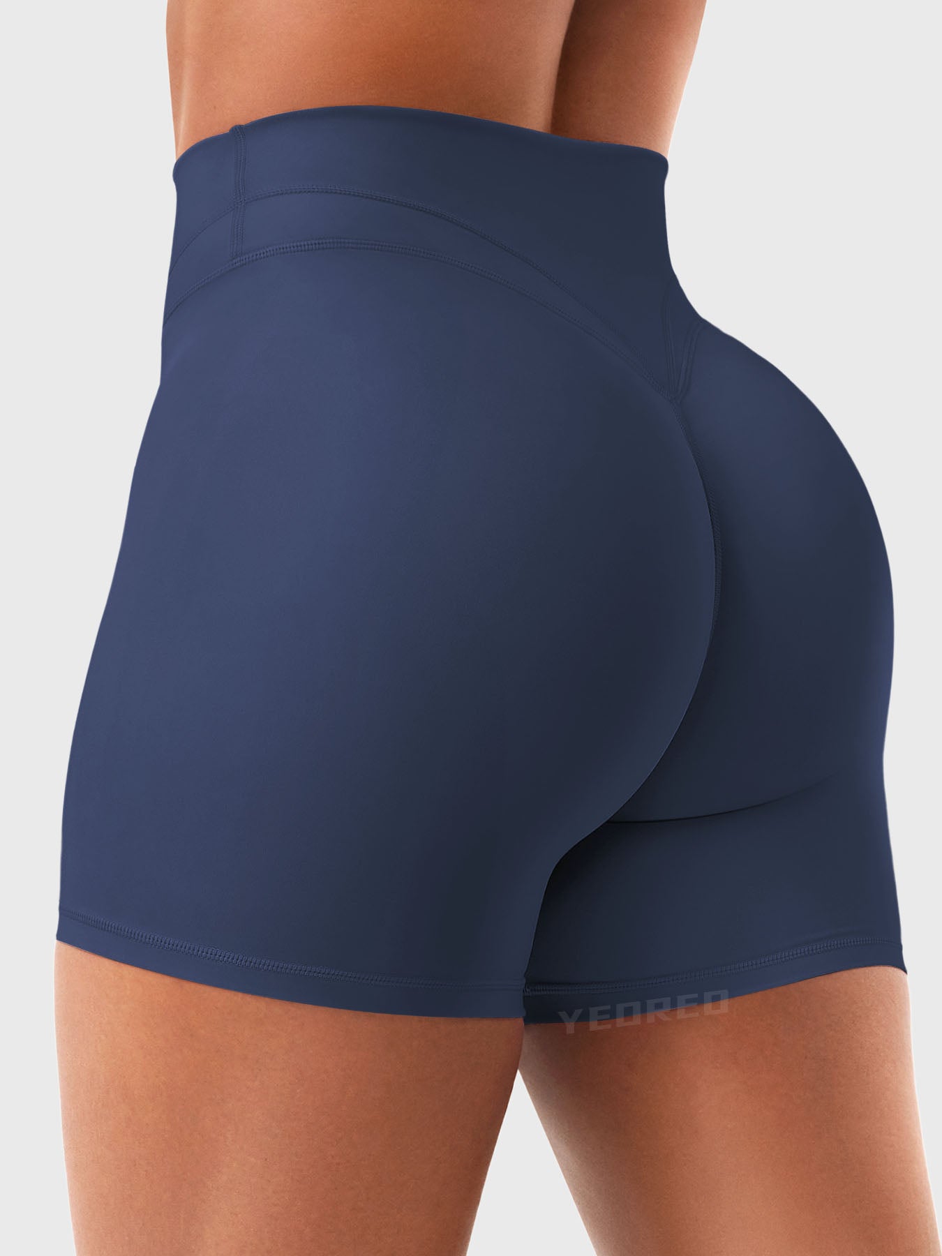 Side Back view of Yeoreo Almiy High Waisted Workout Shorts in Navy – V-stitch waistband and glute-lifting contour
