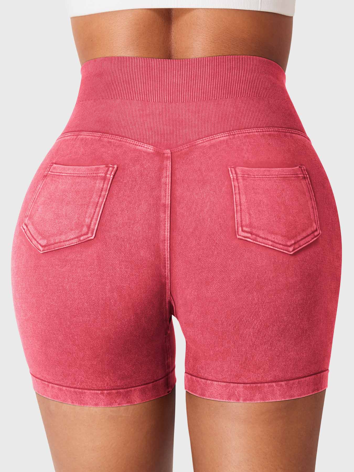 Back view of Yeoreo Bridgie Faux Denim Seamless Shorts in Tile Red– cargo pockets and full peach-lift effect