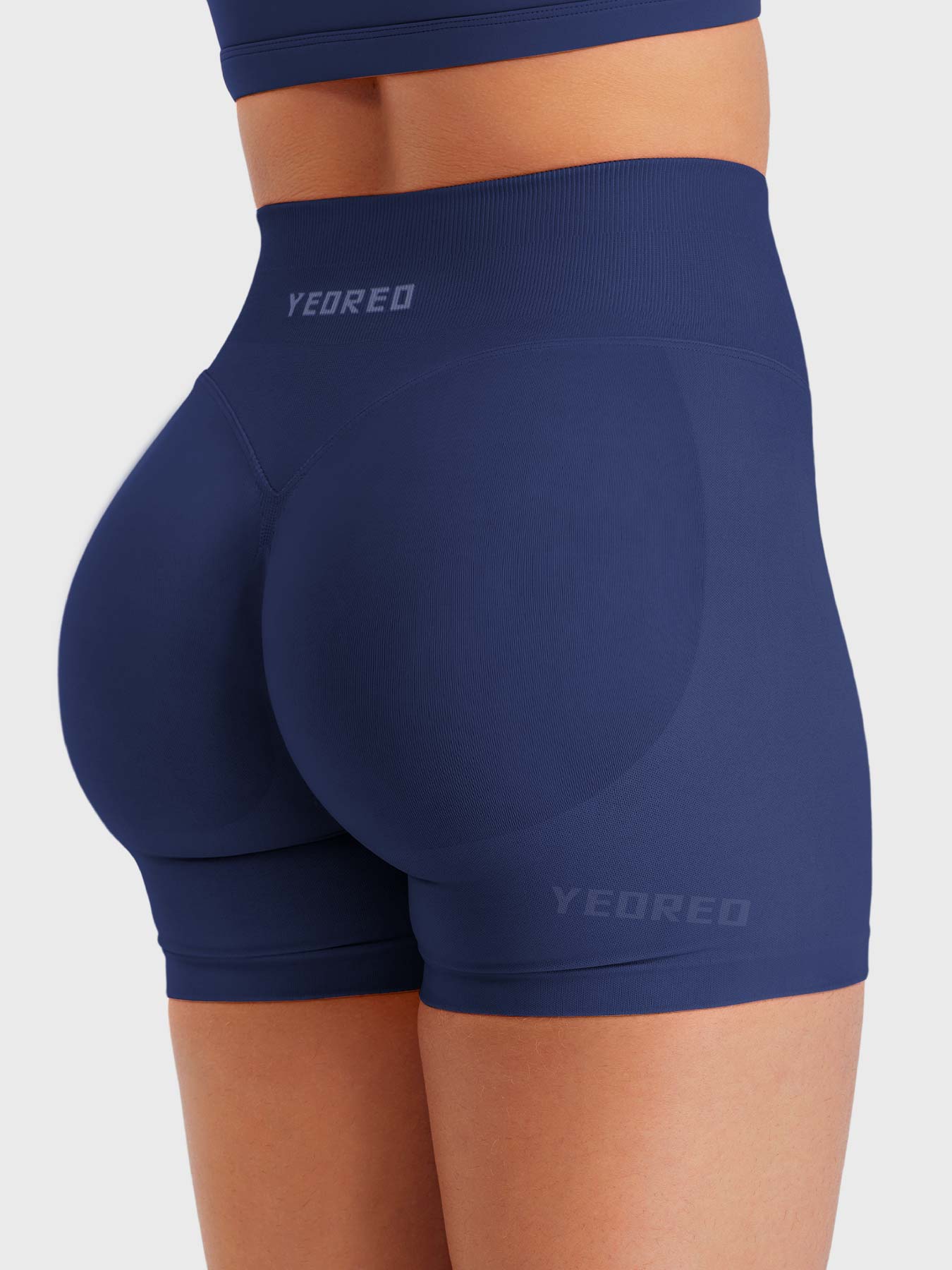 Dark Blue Baderiy 4.5" seamless shorts angled rear view, seamless fit highlighting natural curves