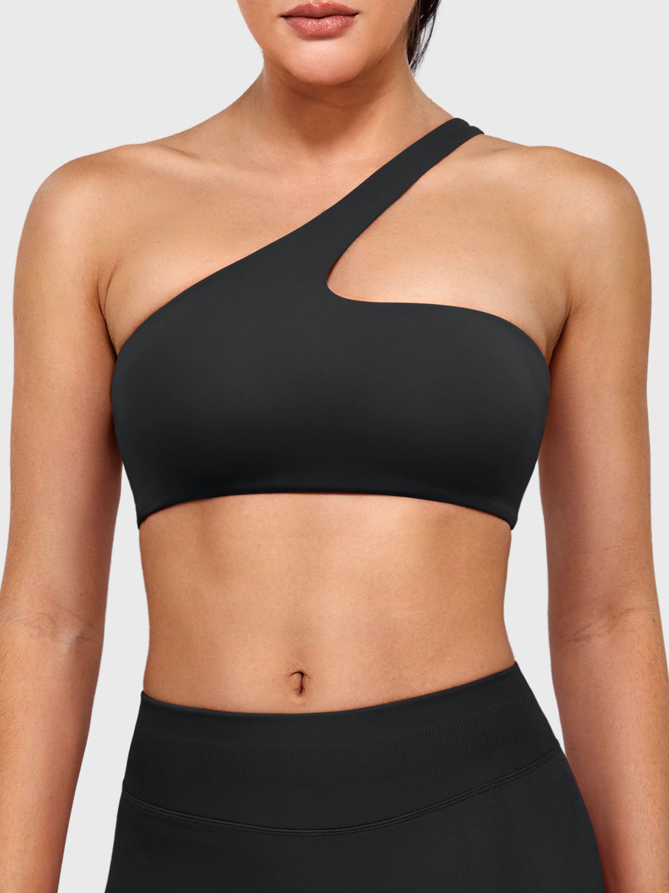 Claranie One Shoulder Sports Bra in black, front view upper body, asymmetric one shoulder design, sleek and sculpting fit