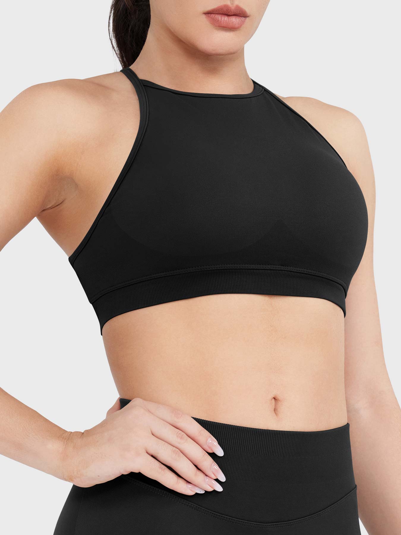Acuffny High Neck Backless Sports Bra in black, angled front upper body view, flattering bust contour, smooth supportive design
