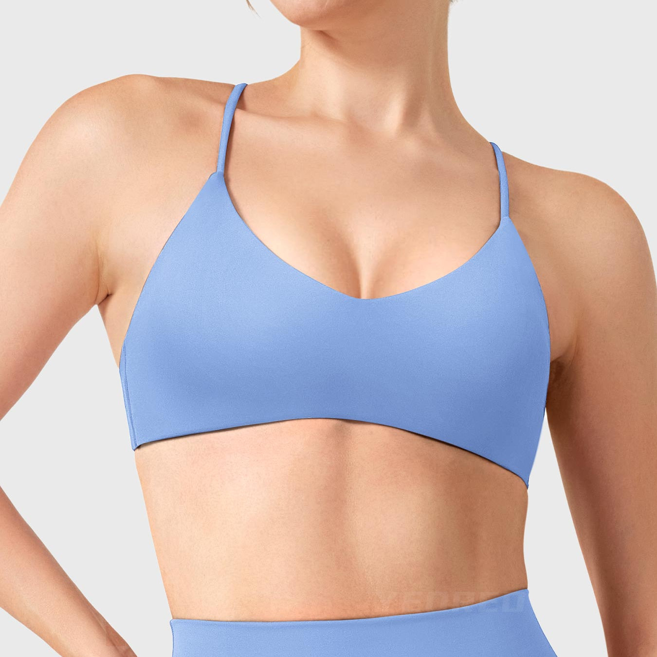 Ice Blue Yeoreo Zaahira V-neck sports bra front view, clean neckline shaping collarbone and shoulders