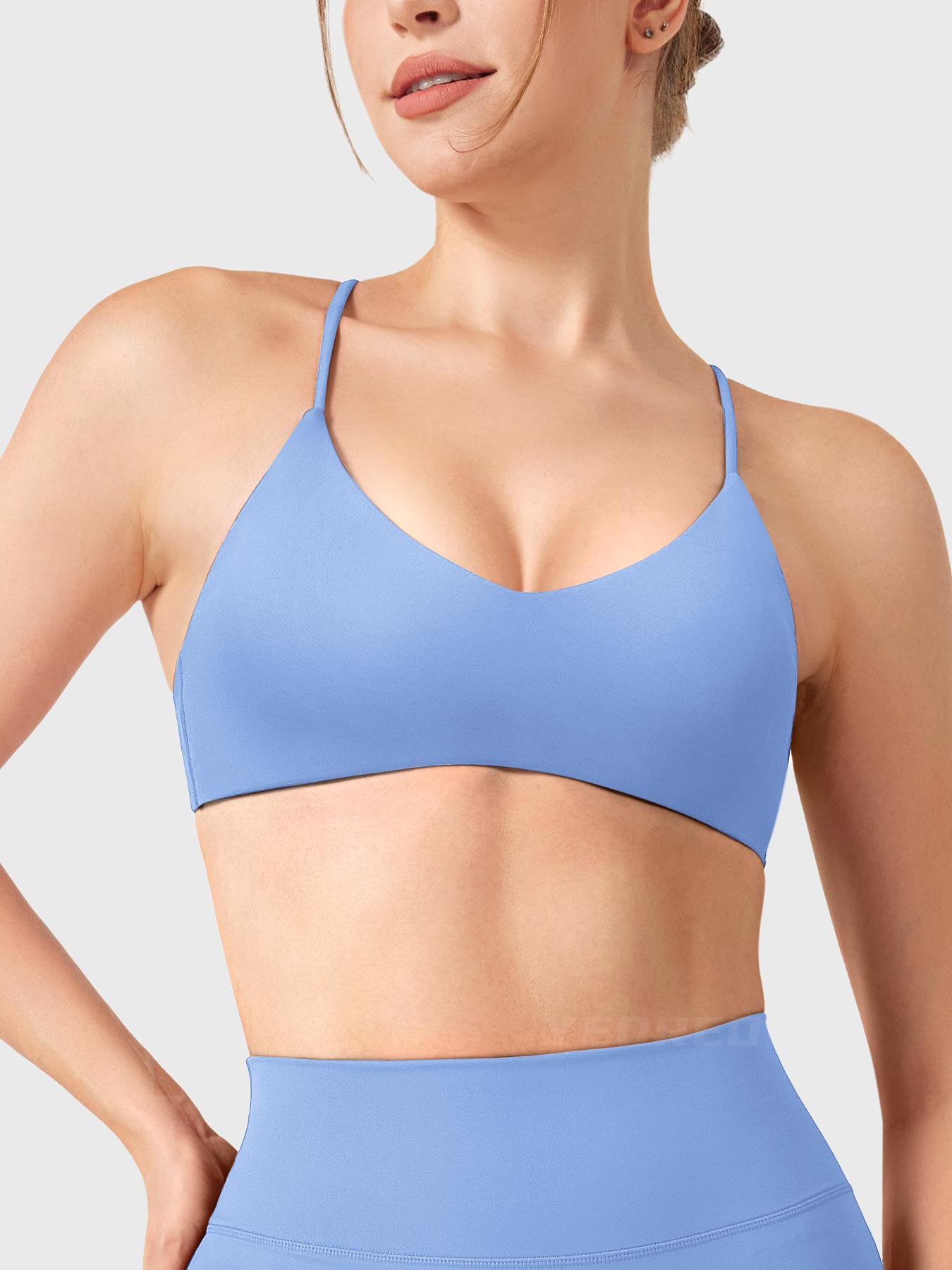 Ice Blue Yeoreo Zaahira V-neck sports bra front view, clean neckline shaping collarbone and shoulders