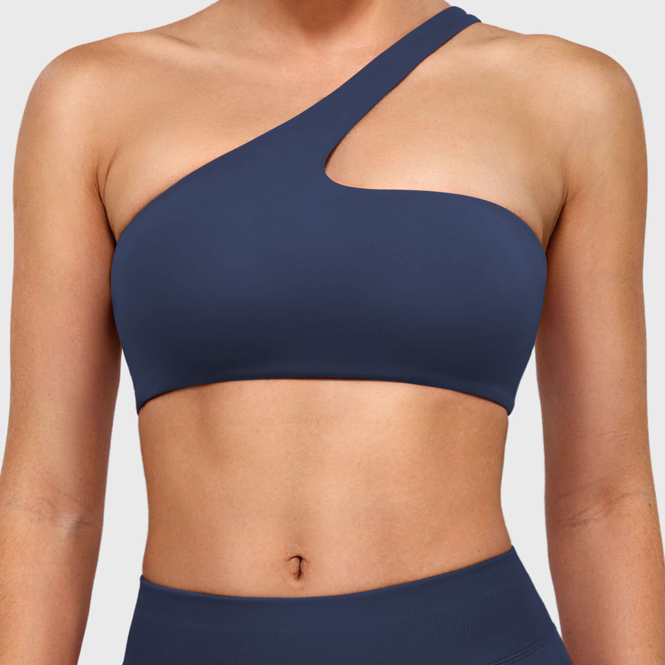 Claranie One Shoulder Sports Bra in navy, front view upper body, one shoulder asymmetric design, sleek supportive fit