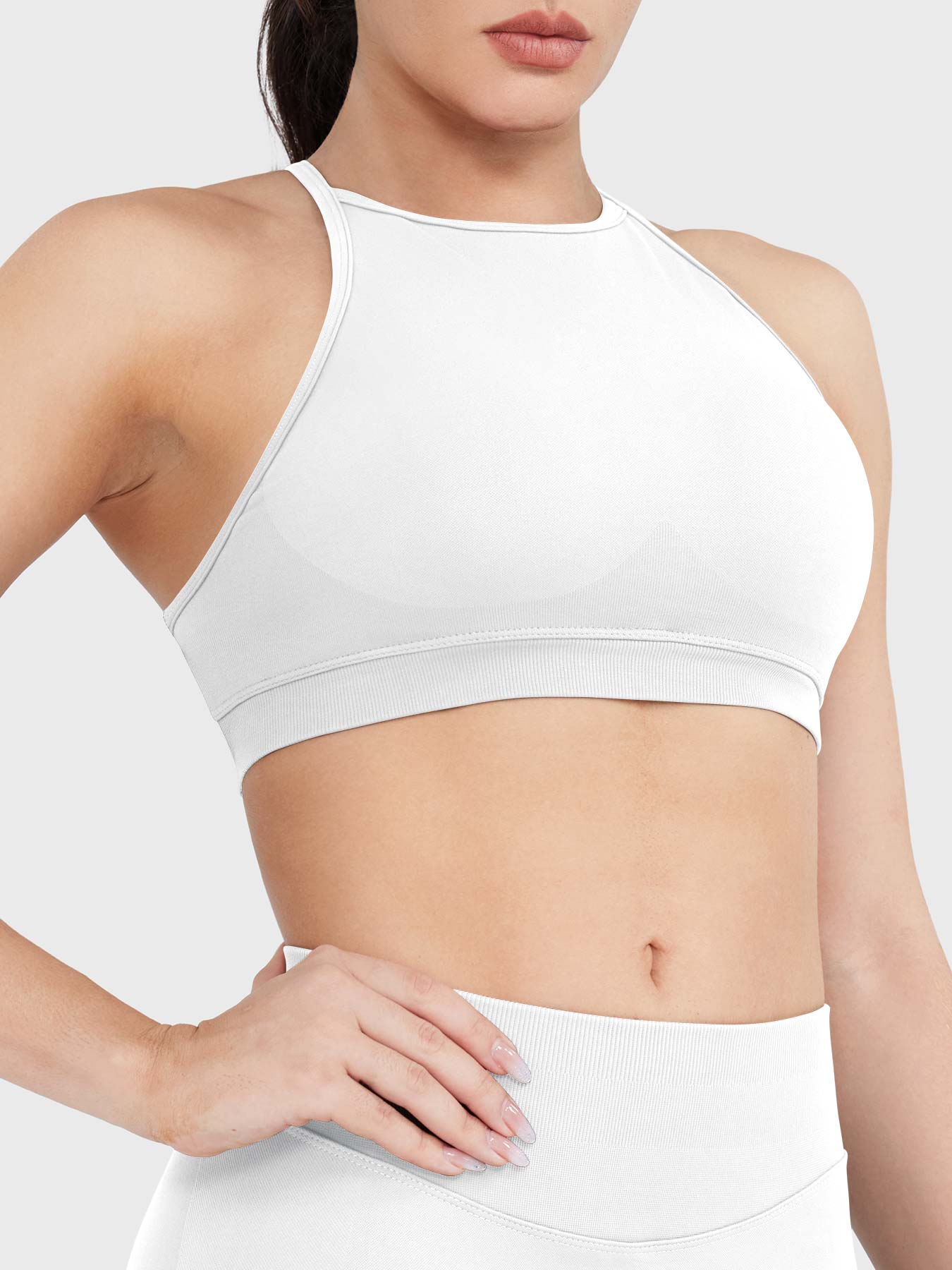 Acuffny High Neck Backless Sports Bra in white, angled front upper body view, sculpted bust shape, smooth and supportive fit