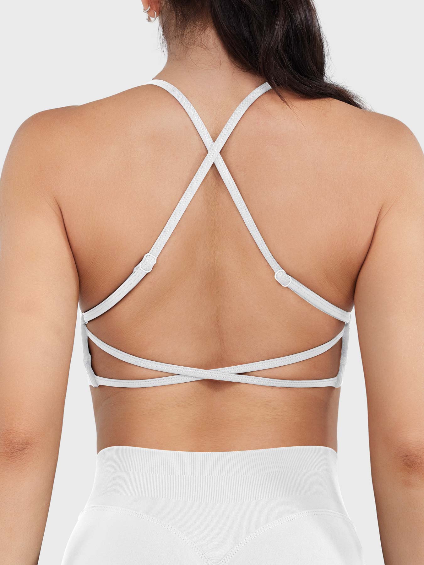 Acuffny High Neck Backless Sports Bra in white, back view upper body, elegant open back design, adjustable cross-back straps