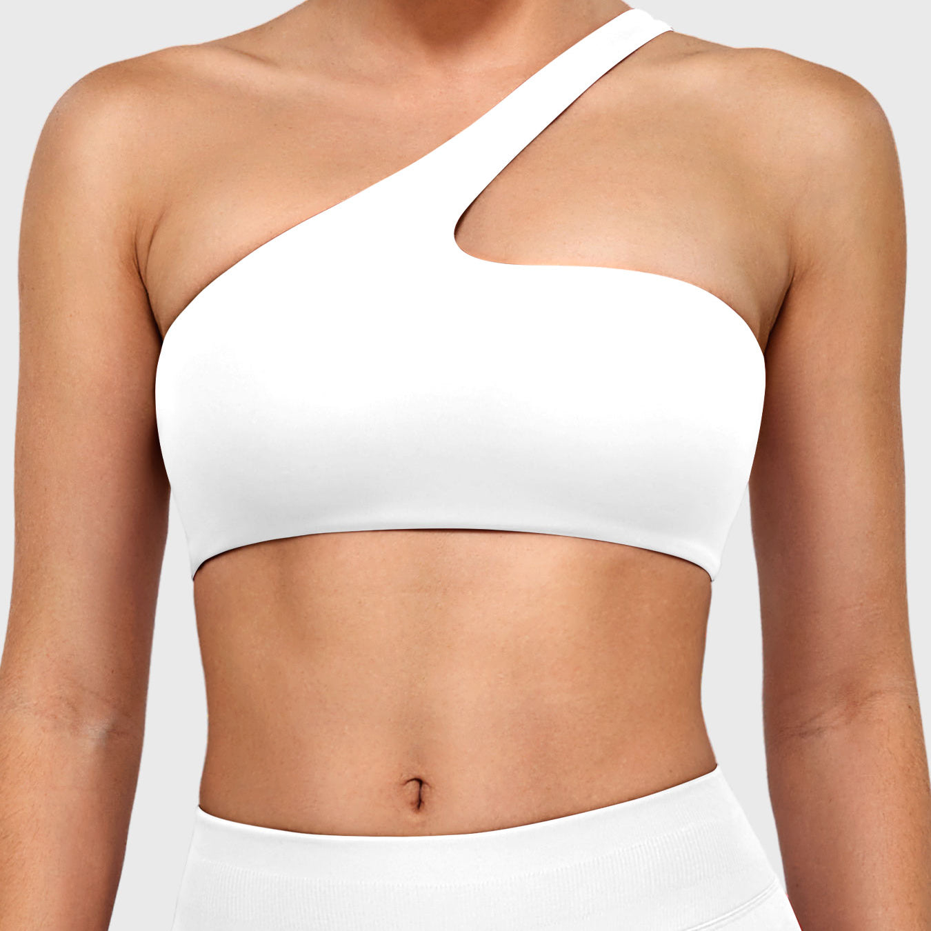 Claranie One Shoulder Sports Bra in white, front view upper body, asymmetric one shoulder neckline, clean fitted silhouette