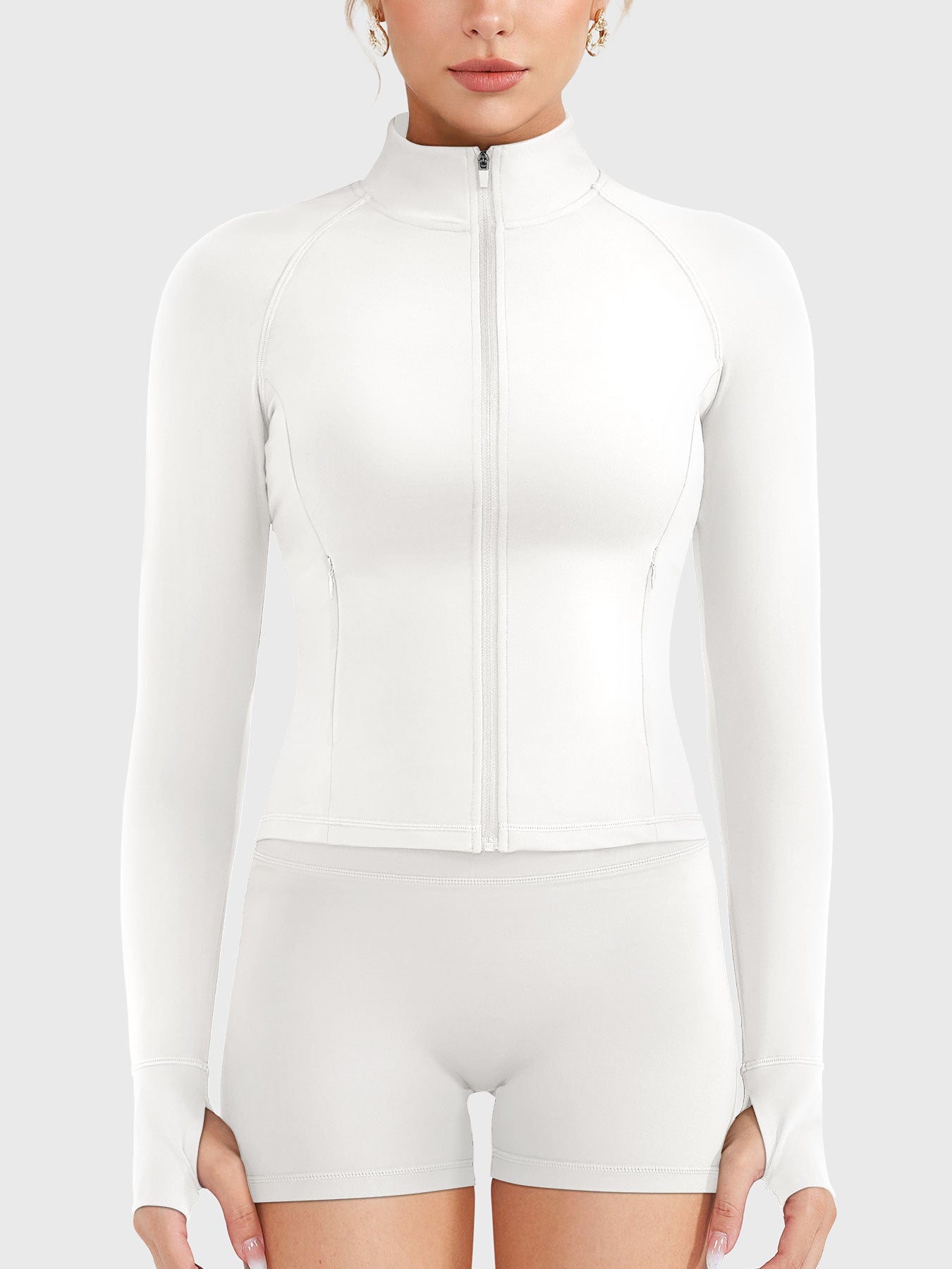 Candecy Full Zip Workout Jacket in white, front view fully zipped, high neck coverage, streamlined and polished fit