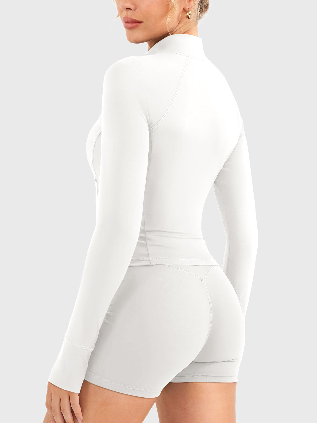 Candecy Full Zip Workout Jacket in white, angled back view, minimal and smooth back design, body-hugging fit