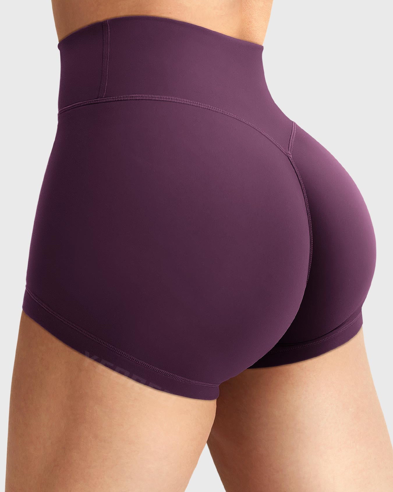 Side-back view close-up of Yeoreo Elysina 2.5" Running Shorts in Black Cherry showing hidden scrunch butt and high rise