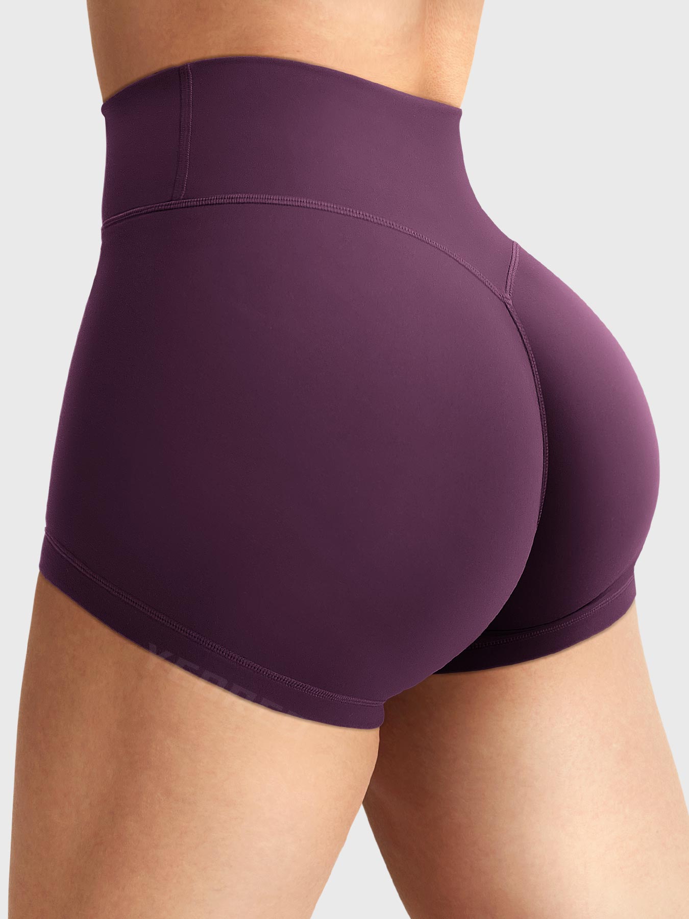 Side-back view close-up of Yeoreo Elysina 2.5" Running Shorts in Black Cherry showing hidden scrunch butt and high rise