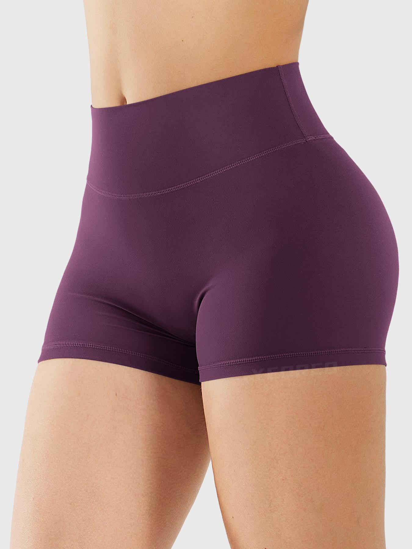 Side-front view of Yeoreo Elysina 2.5" Running Shorts in Black Cherry showing smooth front and high rise