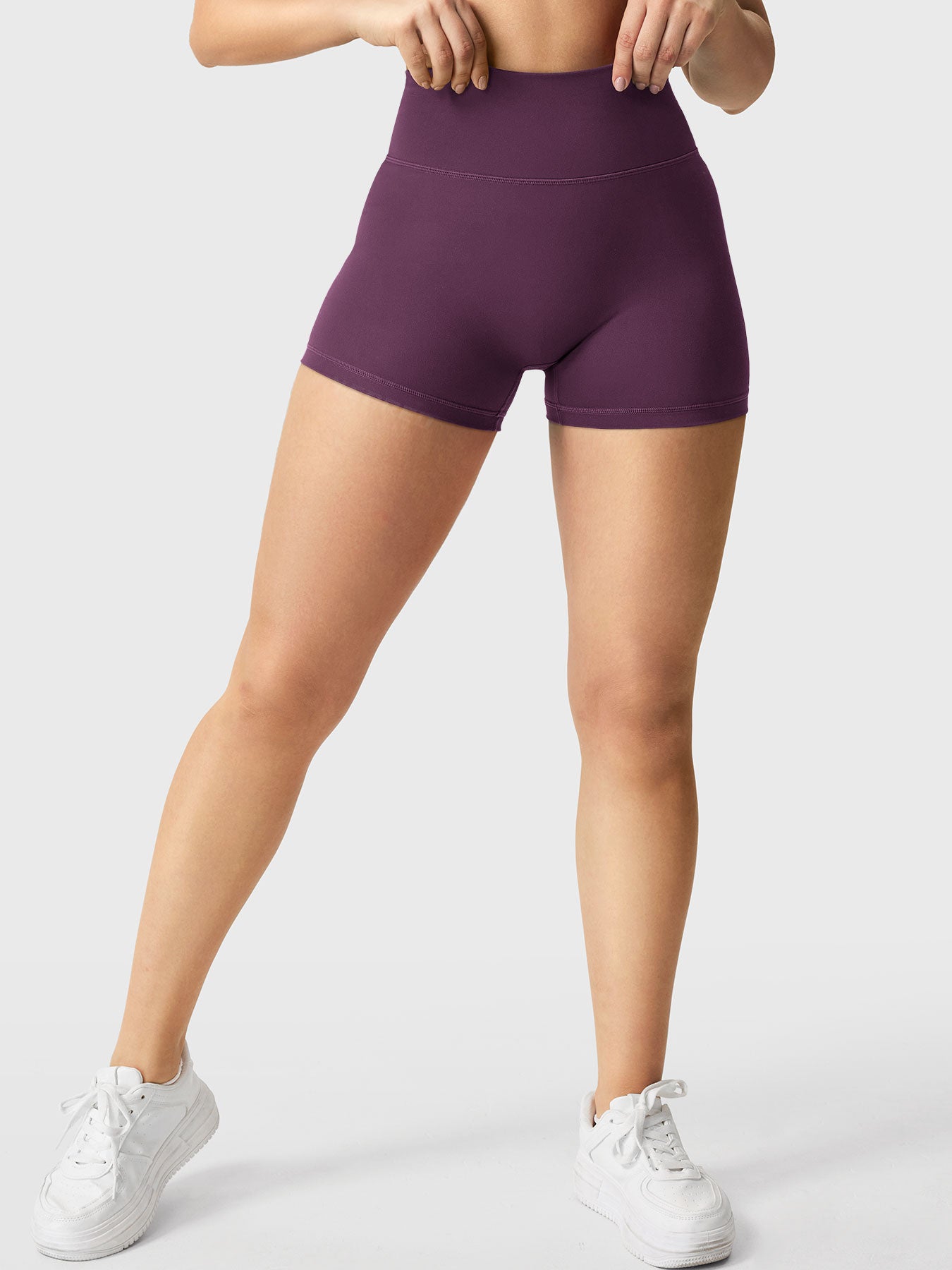Full-length front view of Yeoreo Elysina 2.5" Running Shorts in Black Cherry showing fit and coverage