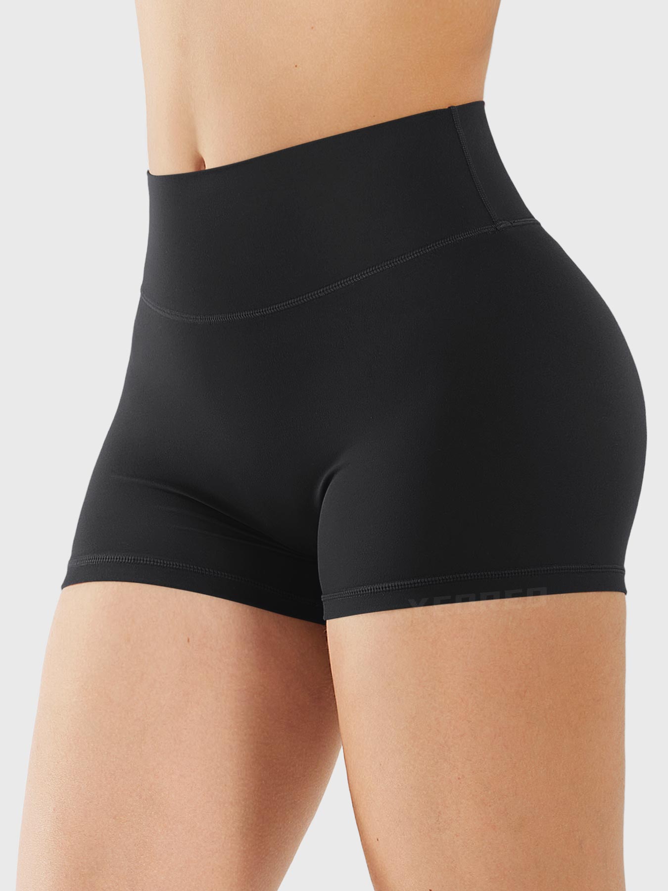 Side-front view of Yeoreo Elysina 2.5" Running Shorts in black showing smooth front and high rise