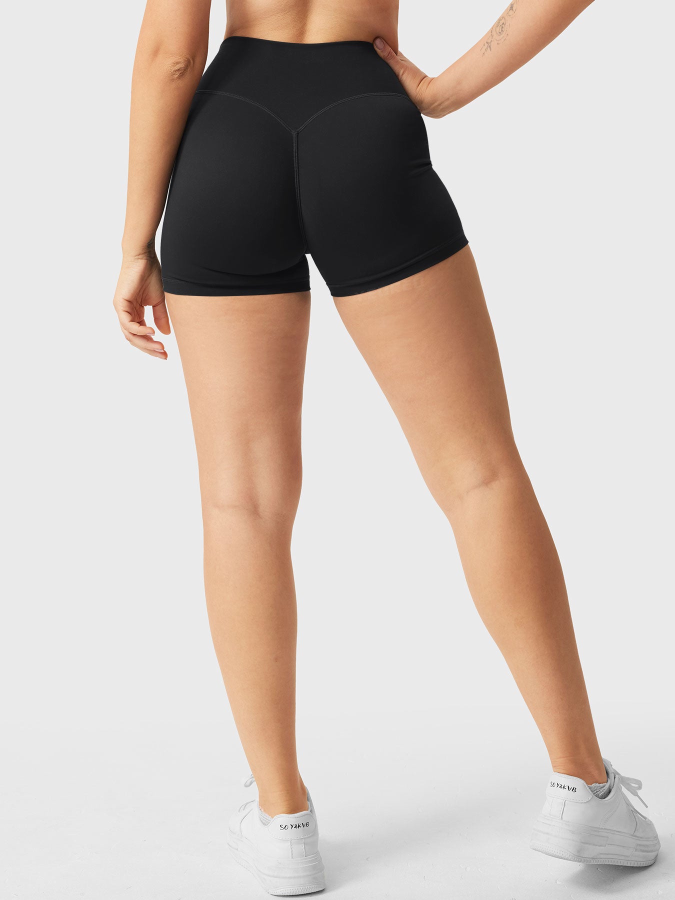 Full-length back view of Yeoreo Elysina 2.5" Running Shorts in black from waist to shoes
