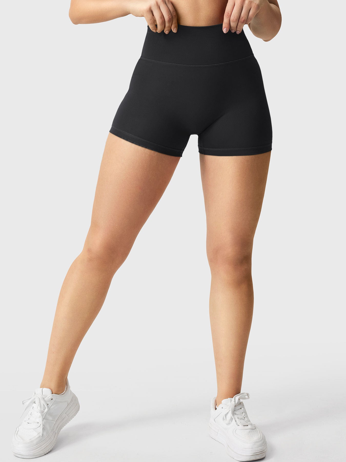 Full-length front view of Yeoreo Elysina 2.5" Running Shorts in black showing fit and coverage