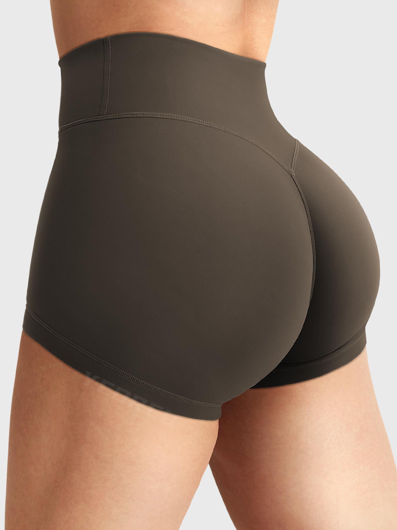 Side-back view close-up of Yeoreo Elysina 2.5" Running Shorts in Deep Brown showing hidden scrunch butt and high rise