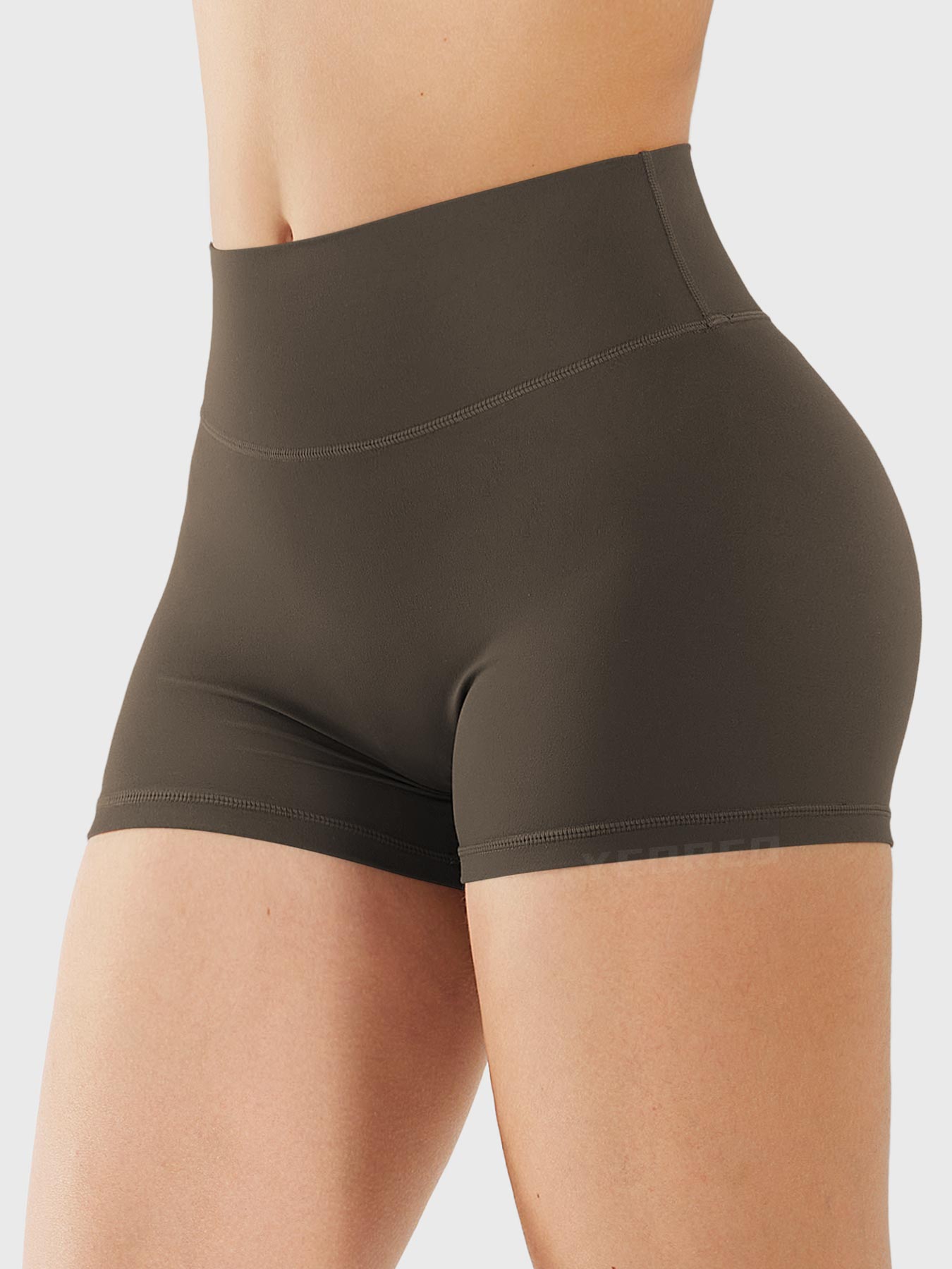 Side-front view of Yeoreo Elysina 2.5" Running Shorts in Deep Brown showing smooth front and high rise