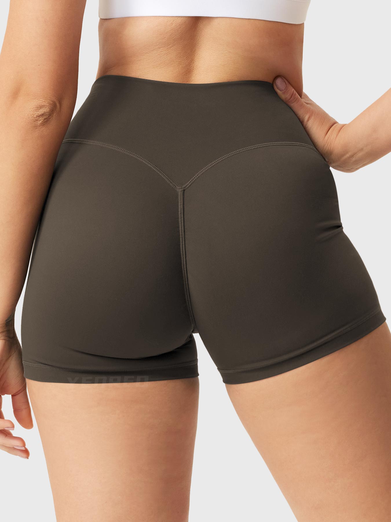 Back view of Yeoreo Elysina 2.5" Running Shorts in Deep Brown highlighting scrunch design