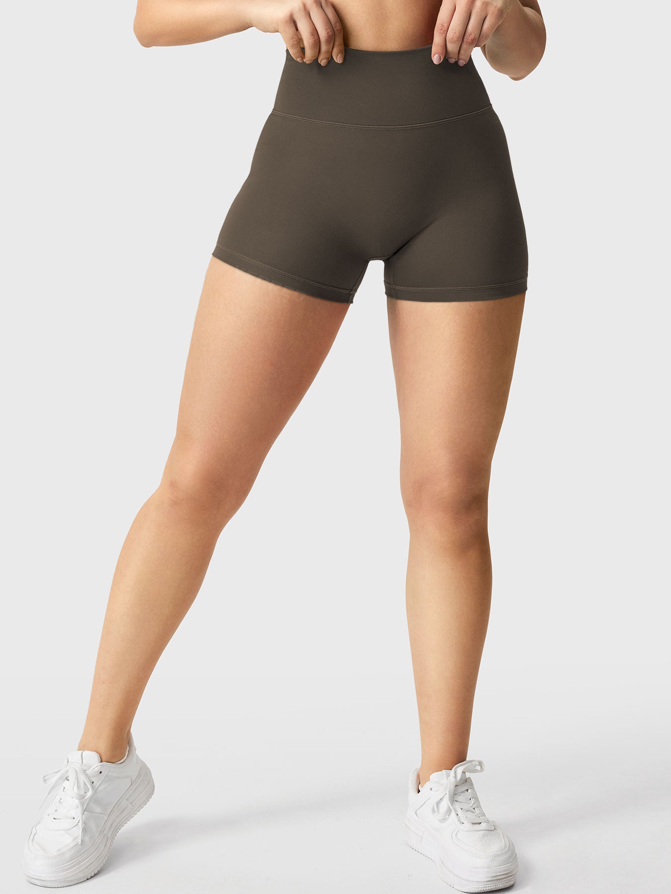 Full-length front view of Yeoreo Elysina 2.5" Running Shorts in Deep Brown showing fit and coverage