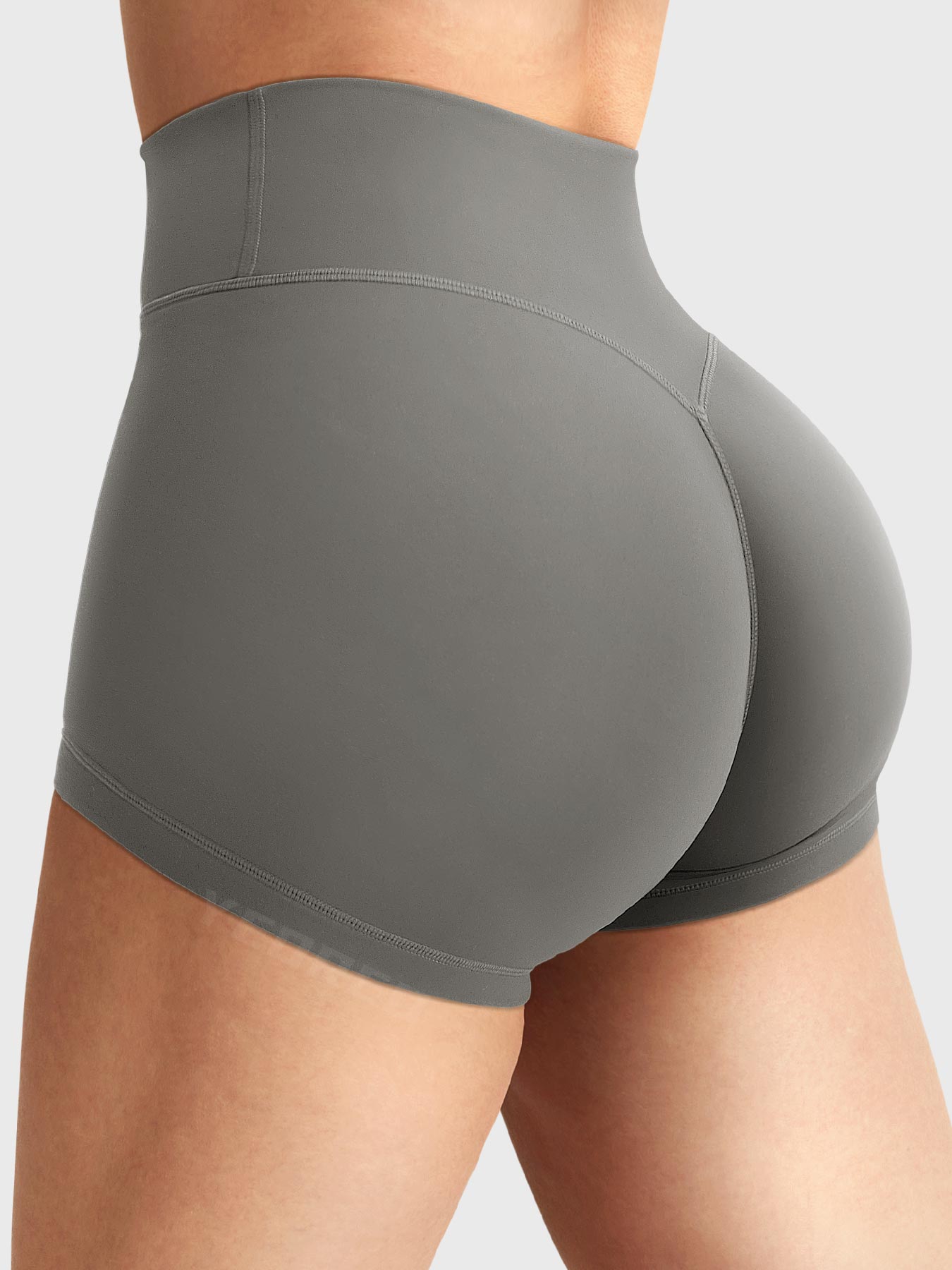 Side-back view close-up of Yeoreo Elysina 2.5" Running Shorts in Dark Grey showing hidden scrunch butt and high rise