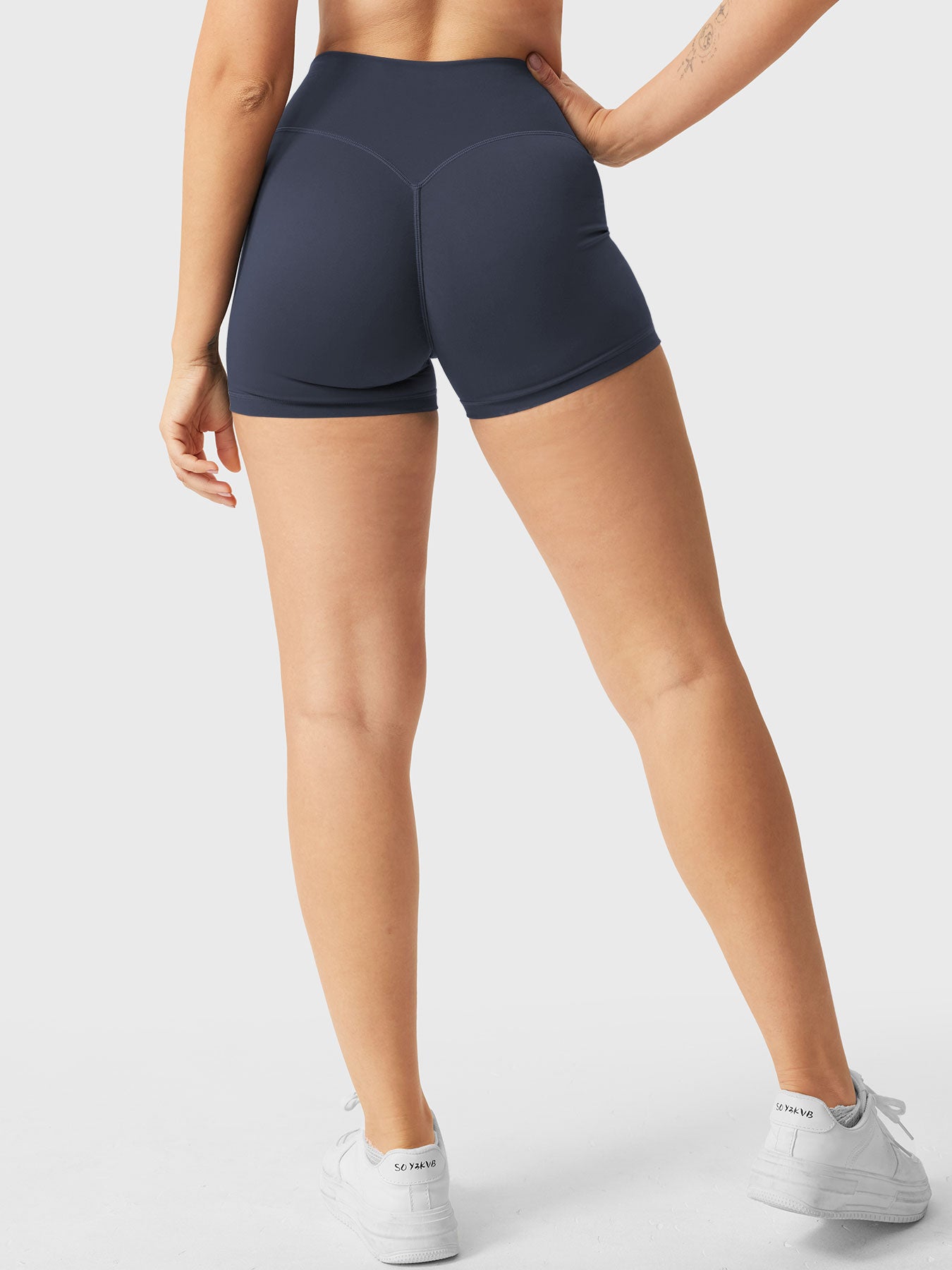 Full-length back view of Yeoreo Elysina 2.5" Running Shorts in Grey Blue from waist to shoes