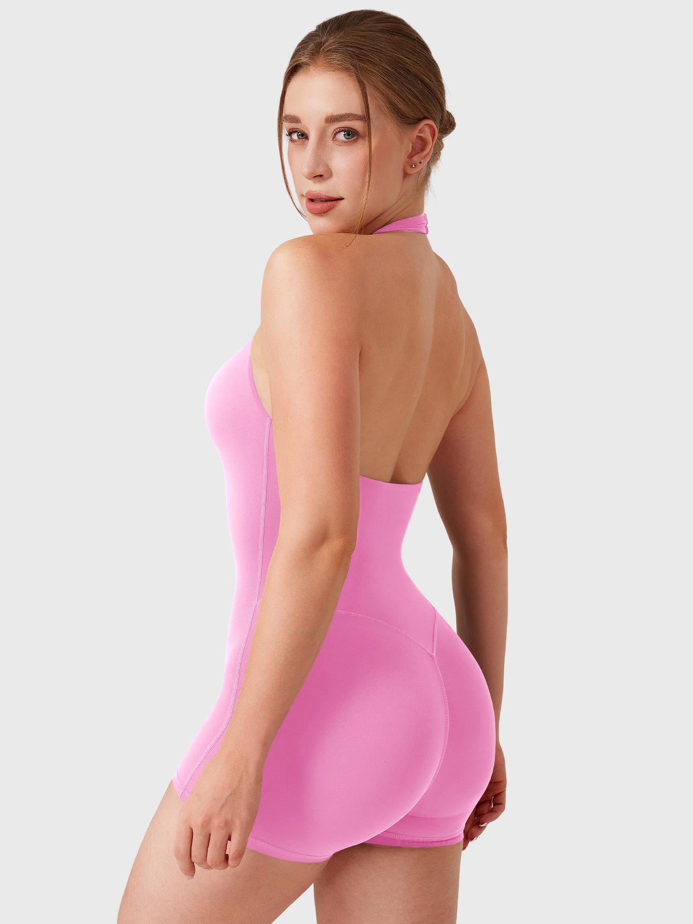 Light Pink Yeoreo Daiane halter romper angled back view, subtle glute lift effect with sculpted contour