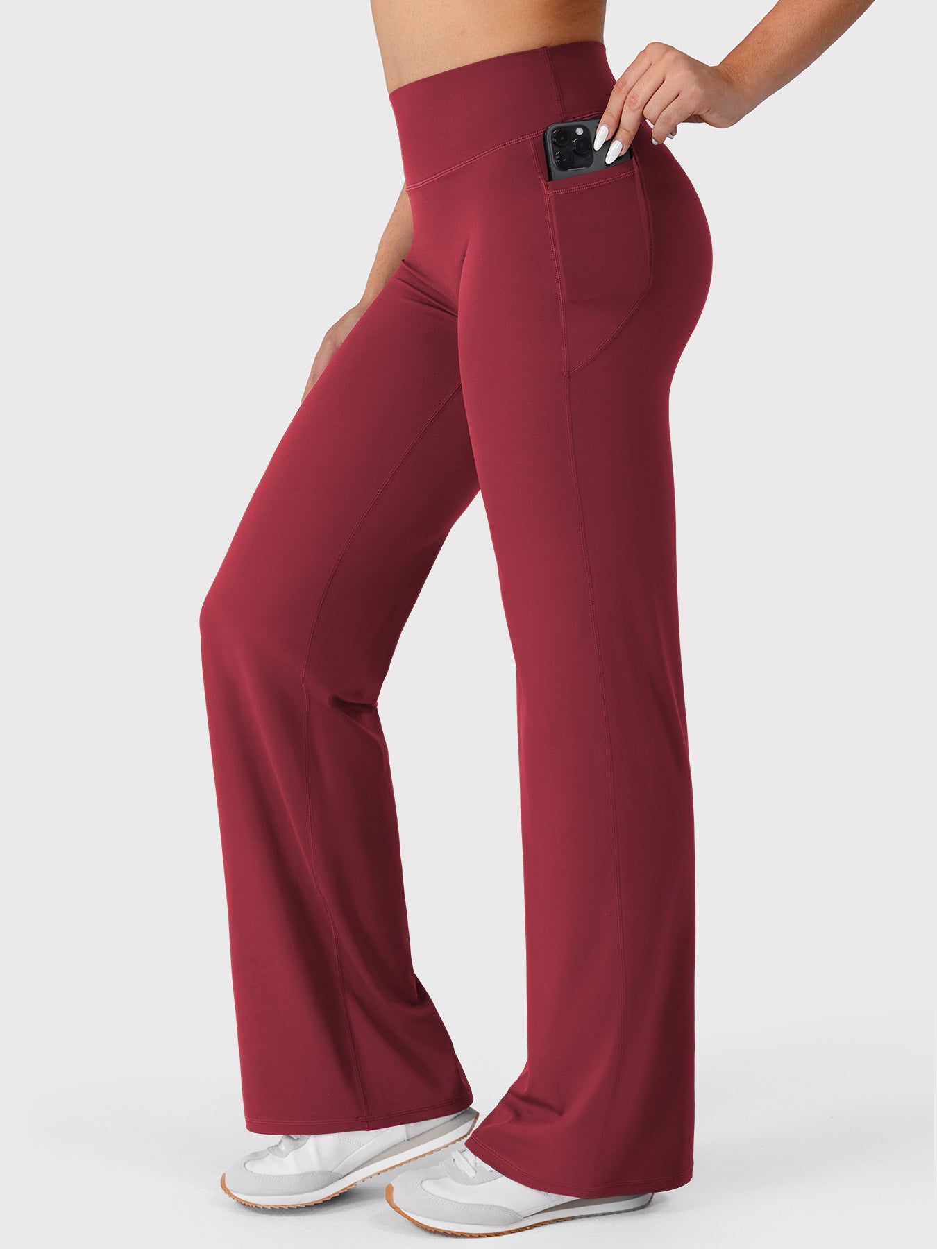 Ancora red straight leg leggings side view showing phone placed inside pocket