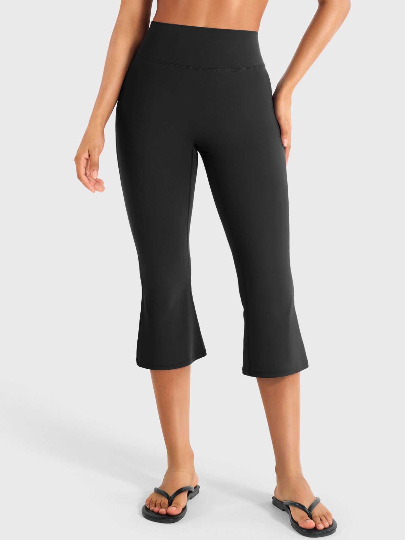 Black Yeoreo Daiane high waisted flare capri leggings front view, 21 inch cropped length with body-hugging fit