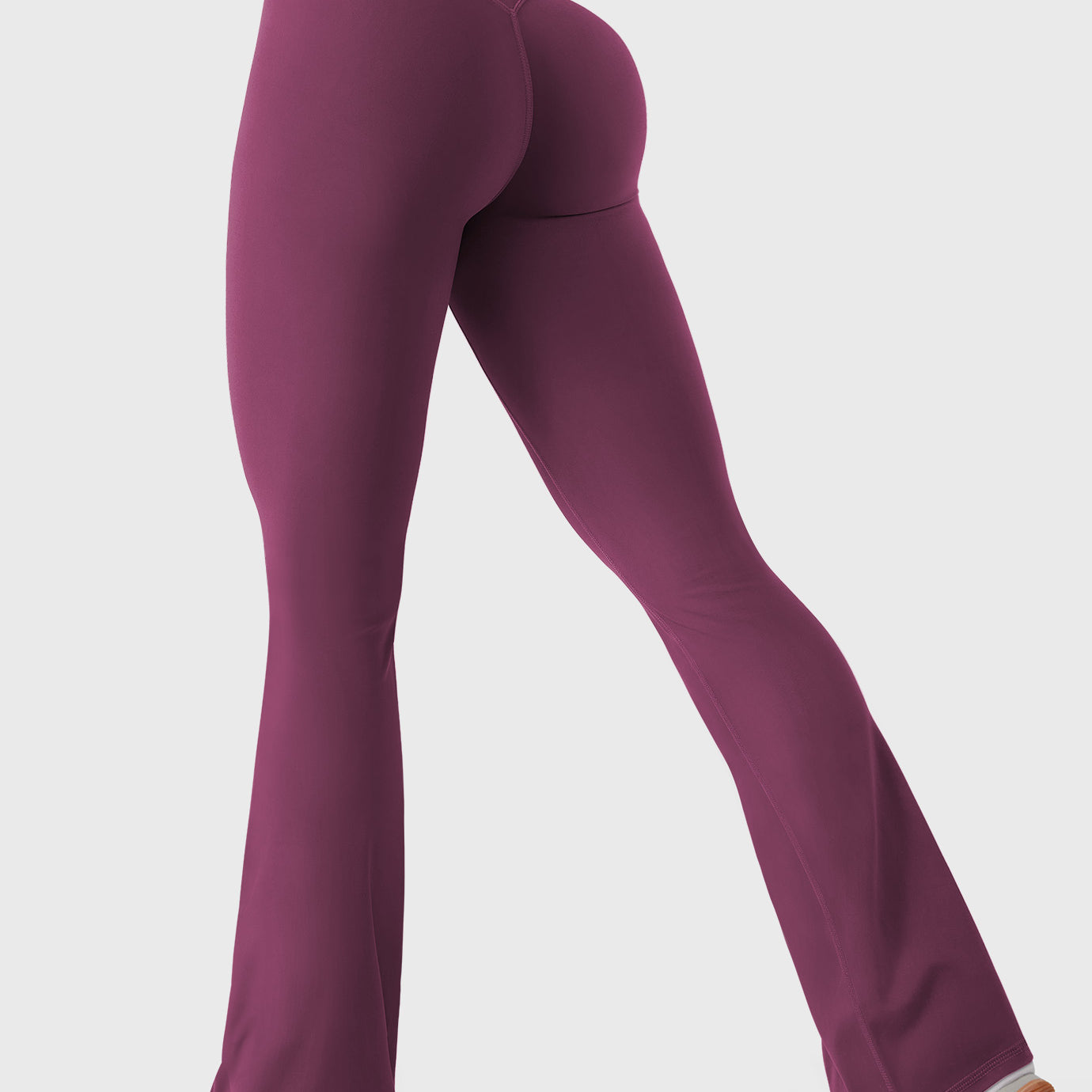 Deep Cherry Red bootcut mini flare leggings with V-back hidden scrunch, walking pose