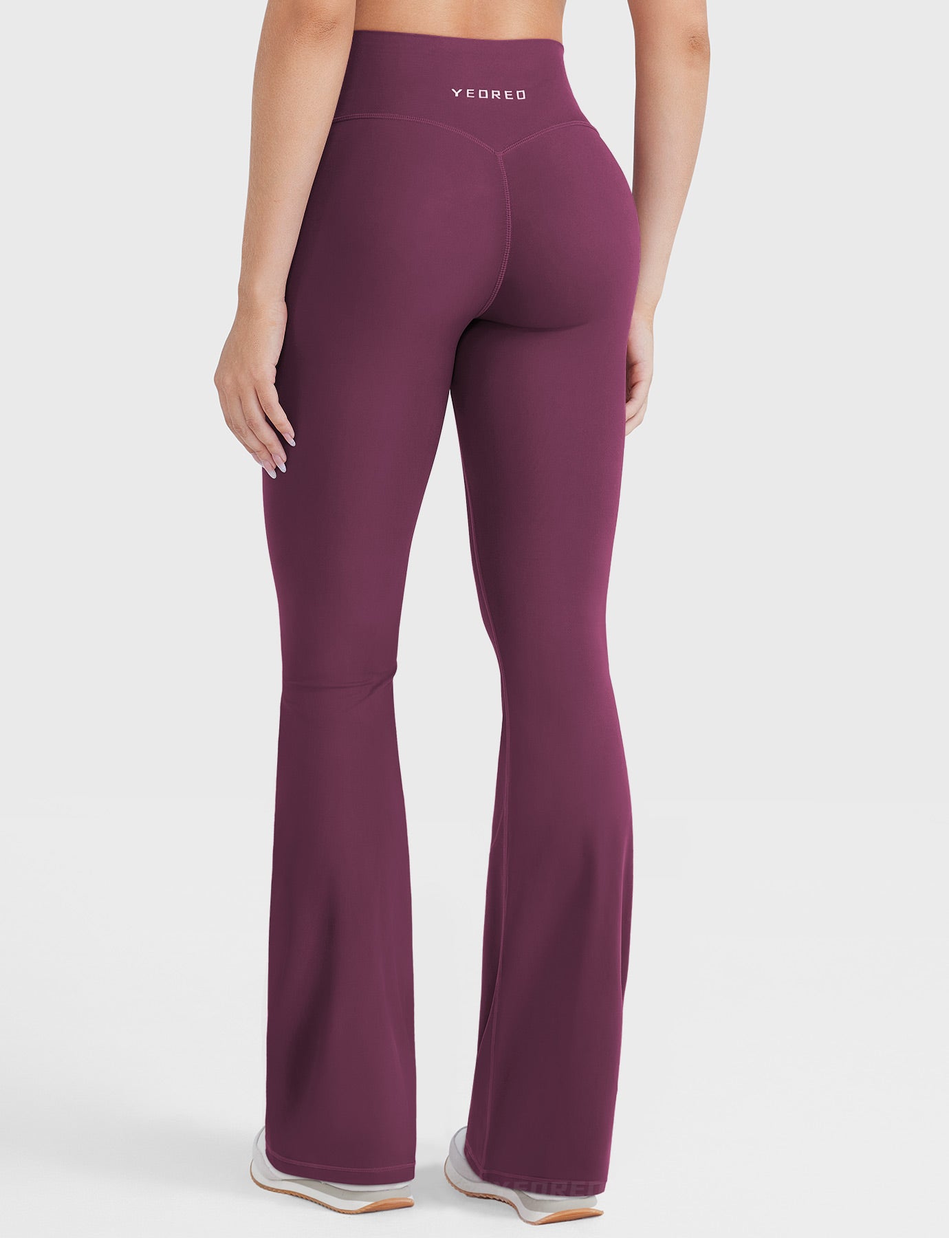 Deep Cherry Red hidden-scrunch bootcut leggings, clean back view
